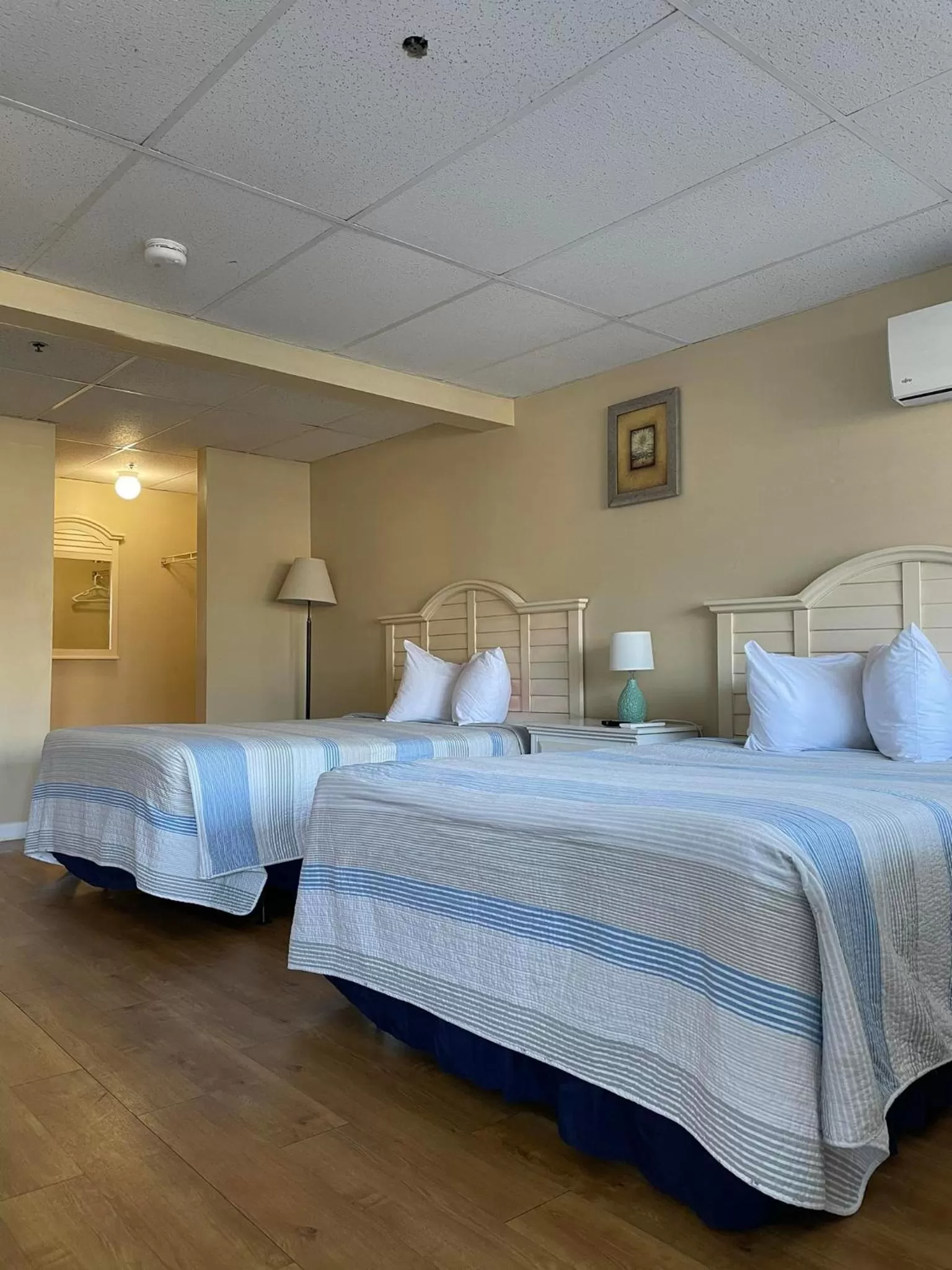 Bed in The Grand Beach Inn