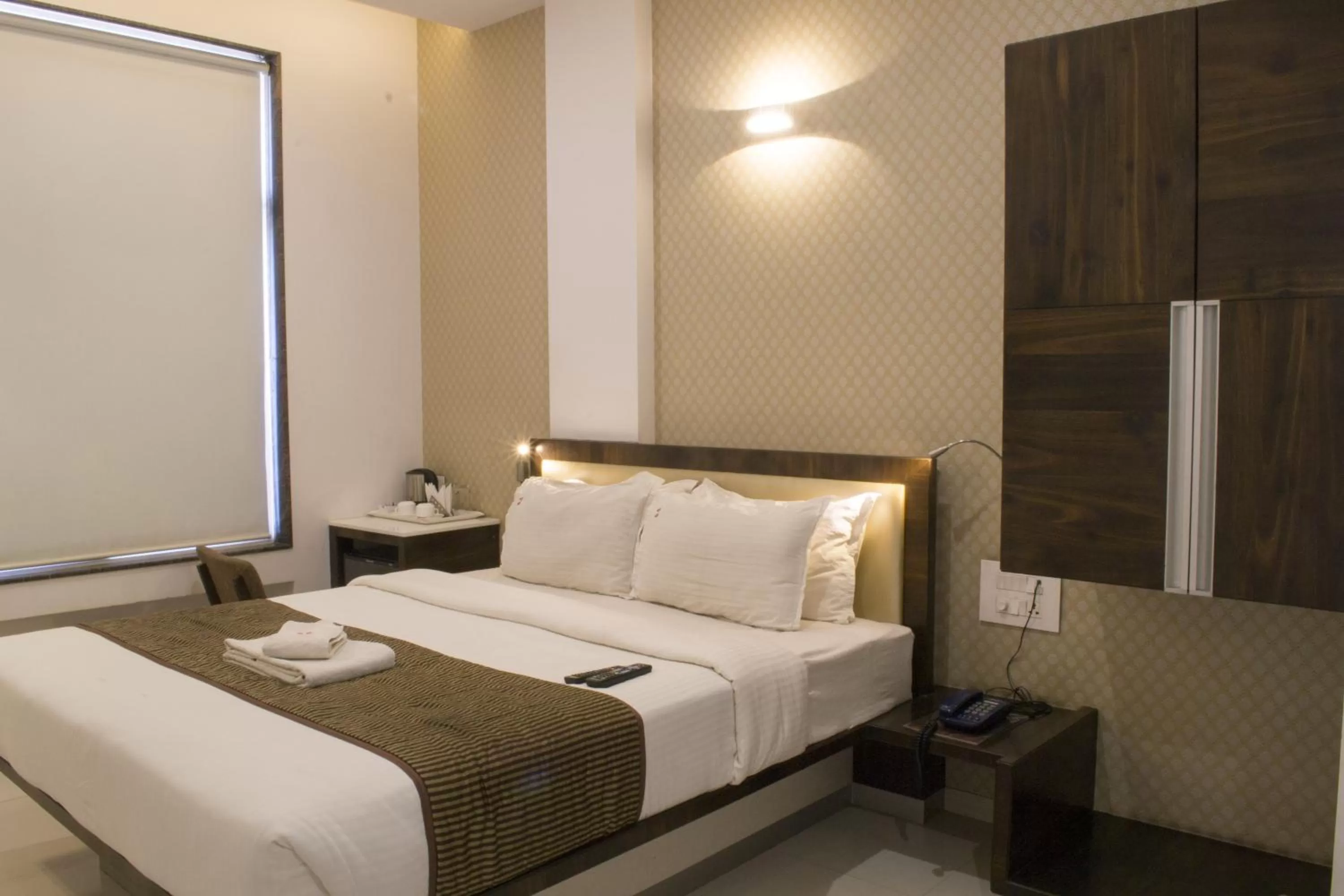 Bedroom, Bed in Hotel SRI SRI EXECUTIVE KOLHAPUR NEAR MAHALAXMI TEMPLE