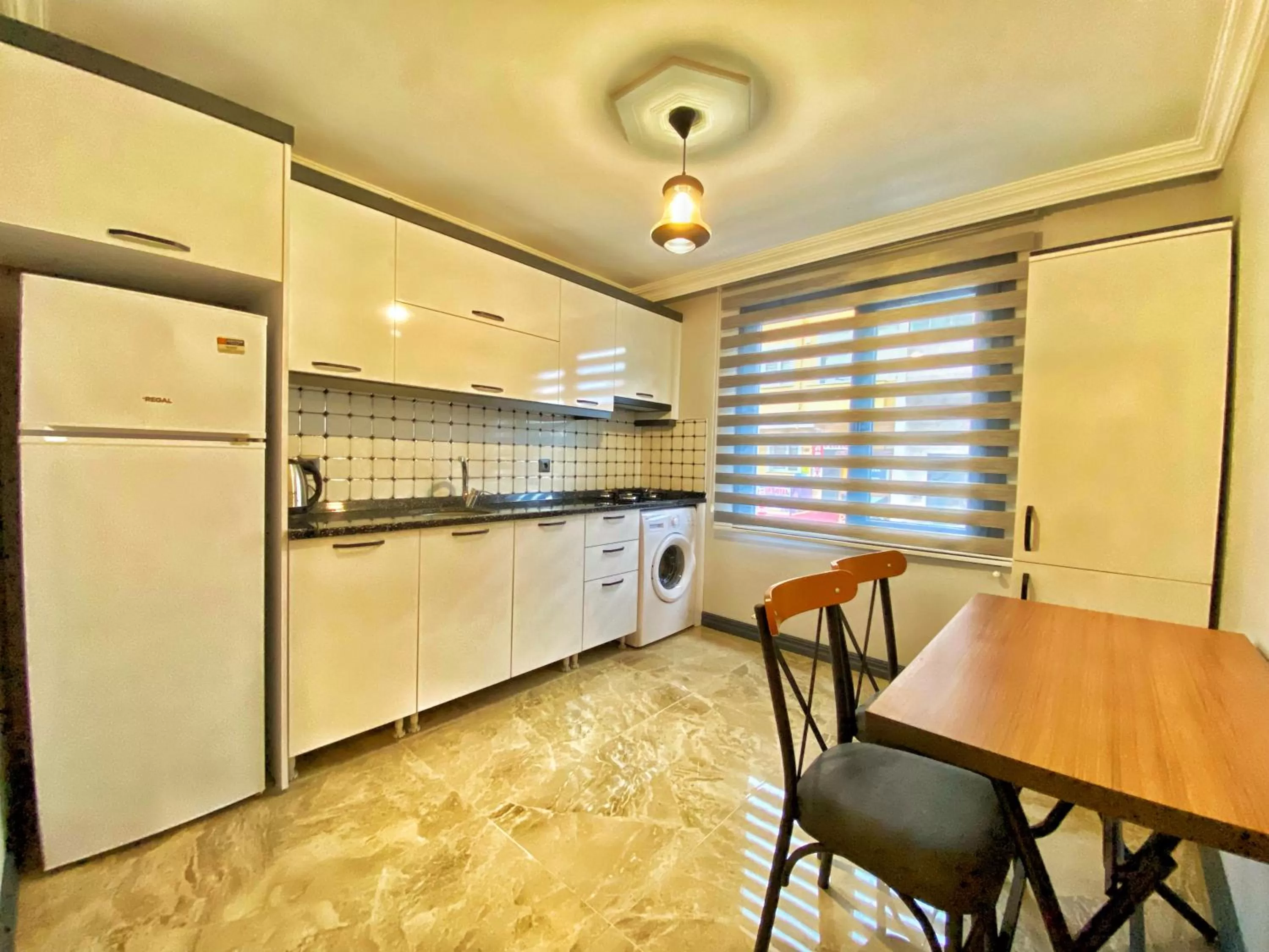 Communal kitchen in My House Suite