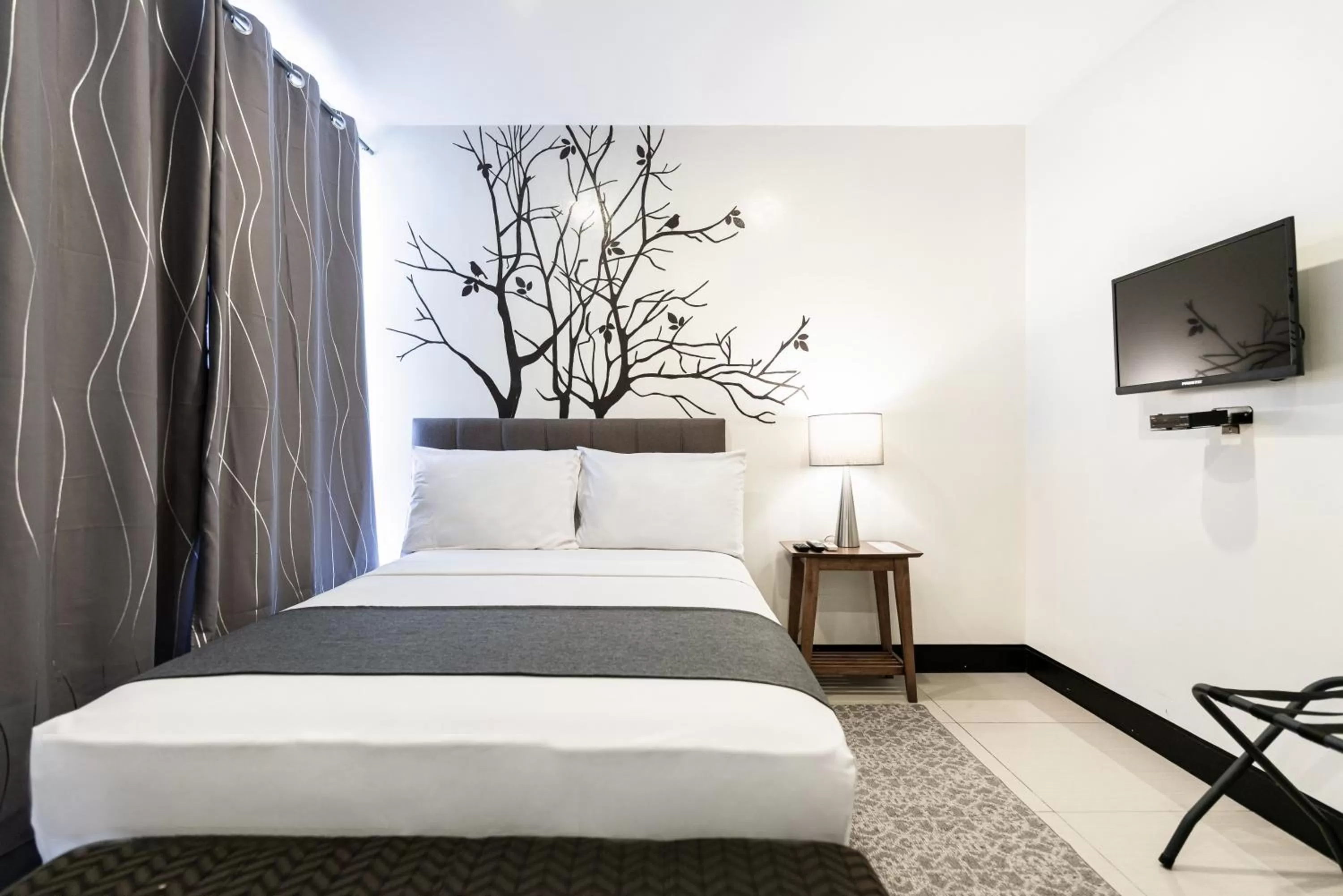 Bedroom, Bed in Artemis Place Makati Hotel