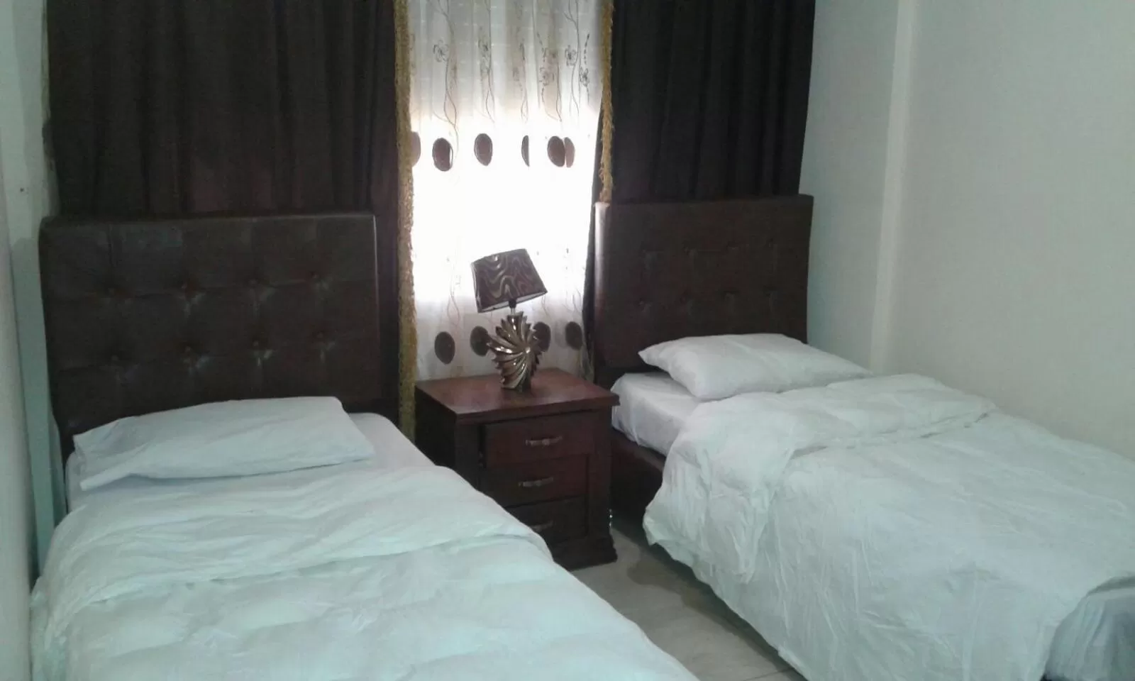 Bed in Al Tawheed Hotel Apartments