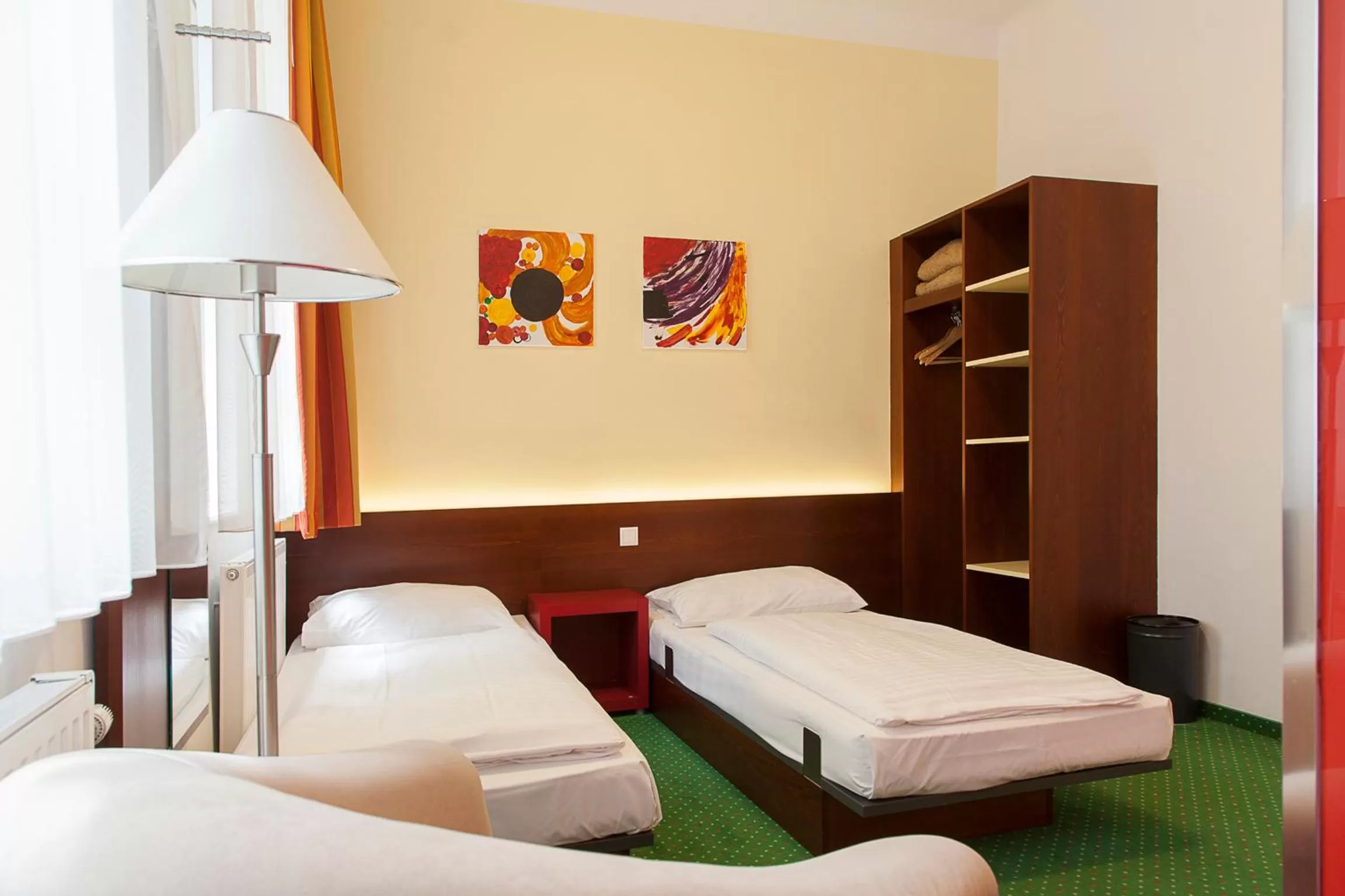 Photo of the whole room, Bed in Pension Stadthalle