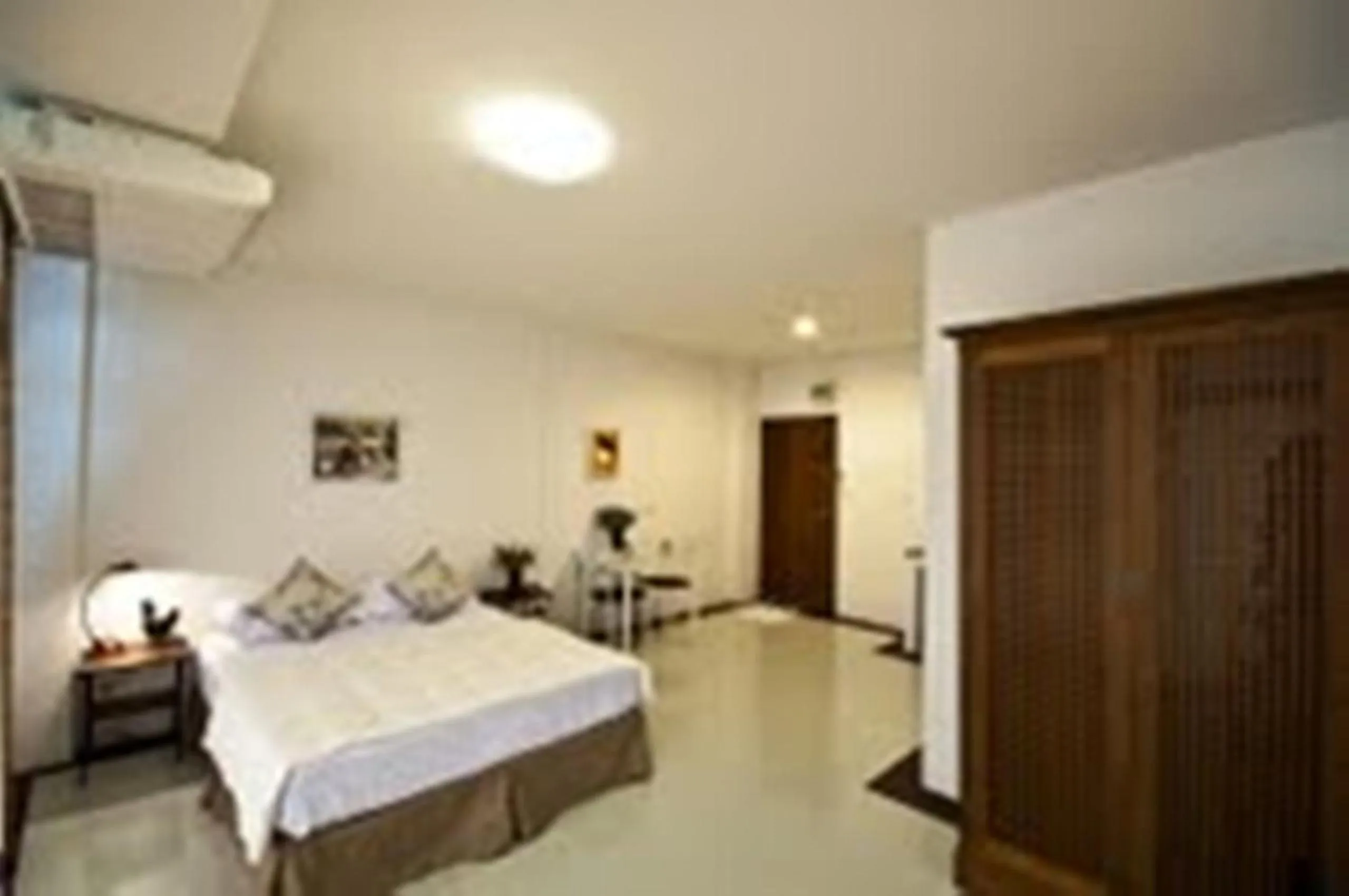 Bed in The Meet Green Apartment