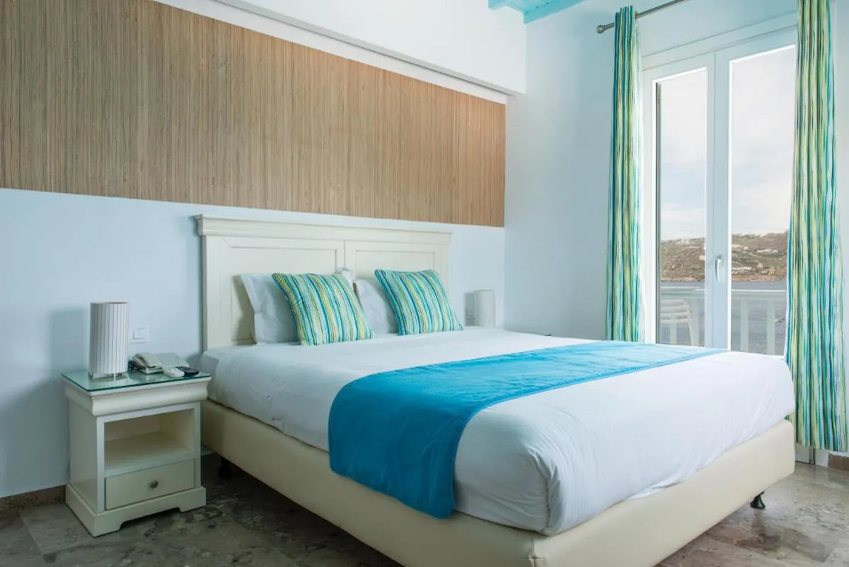 Bed in Poseidon Hotel Suites