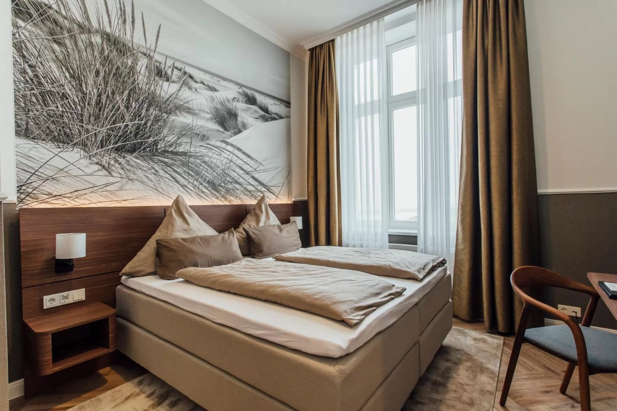 Photo of the whole room, Bed in Strandhotel Hohenzollern