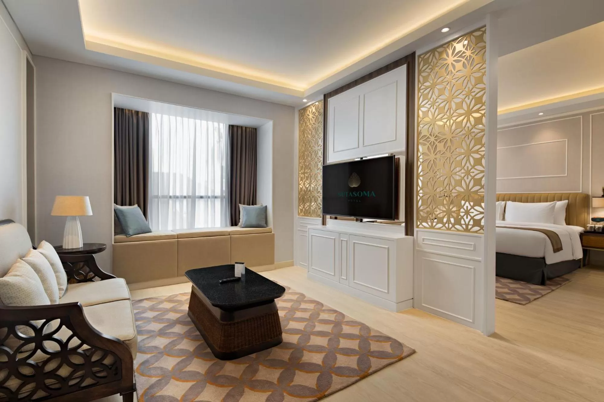 Communal lounge/ TV room, Bed in Sutasoma Hotel