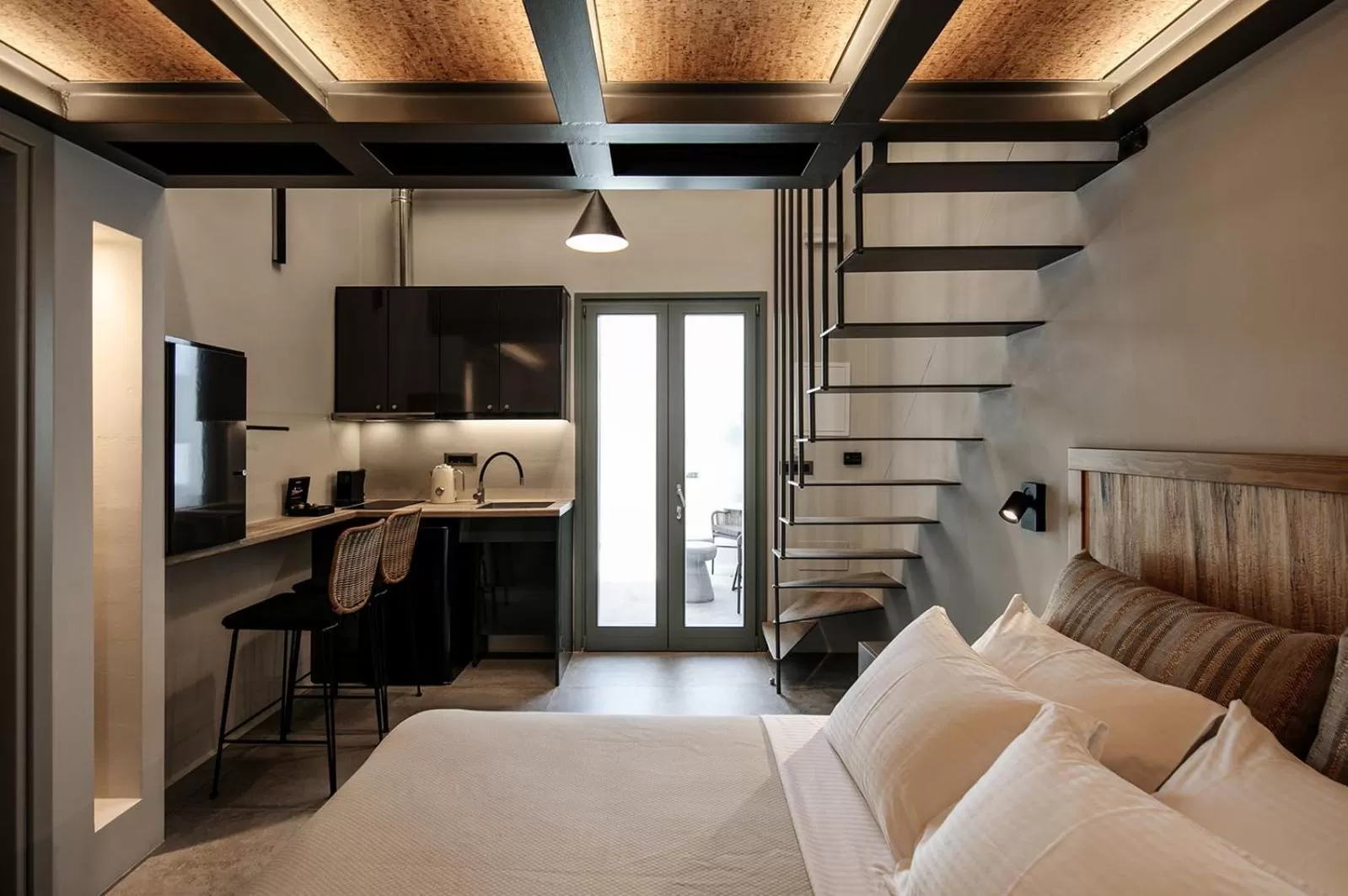 Bed, Kitchen/Kitchenette in Makava Suites Naxos