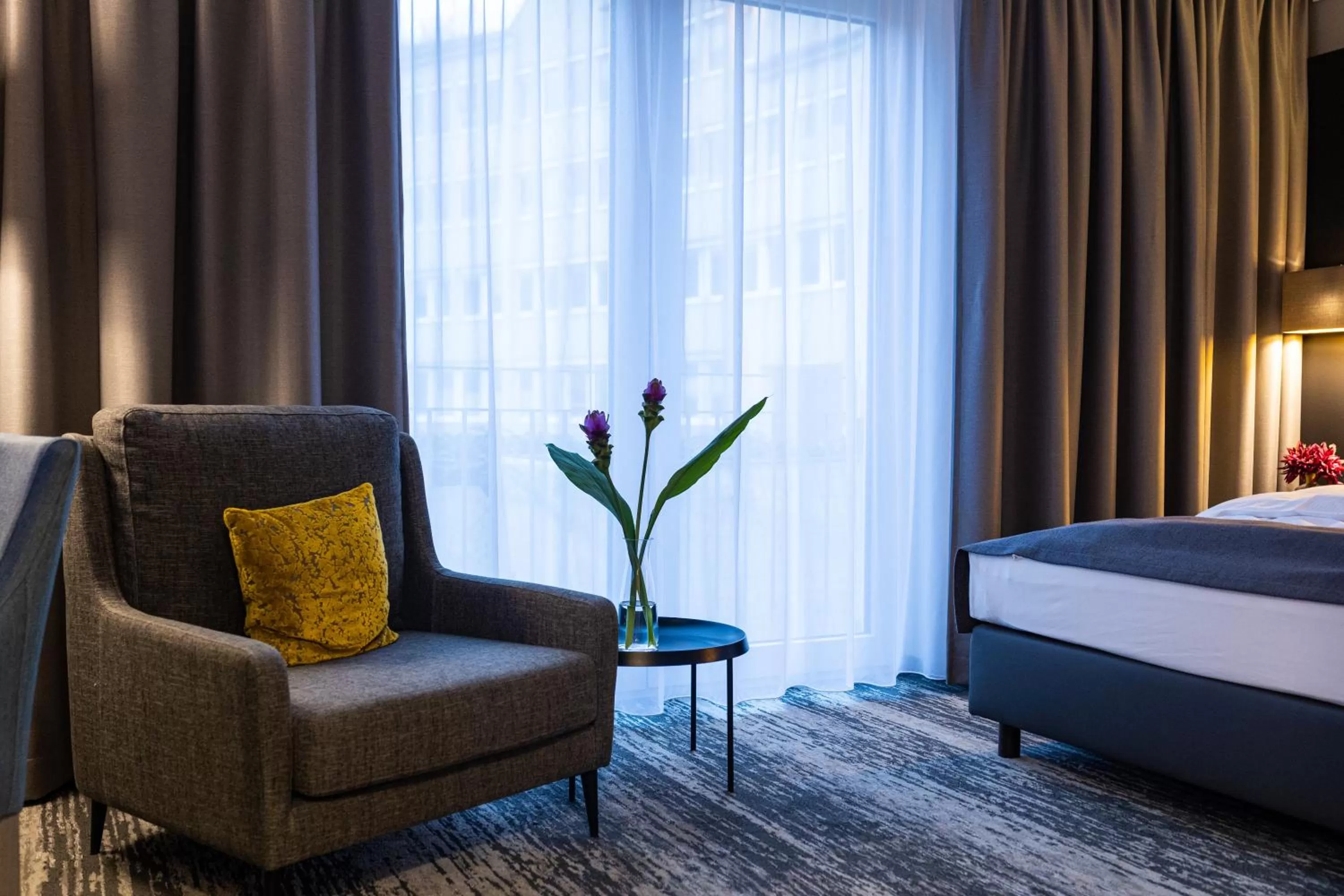 Seating area, Bed in Kranz Parkhotel