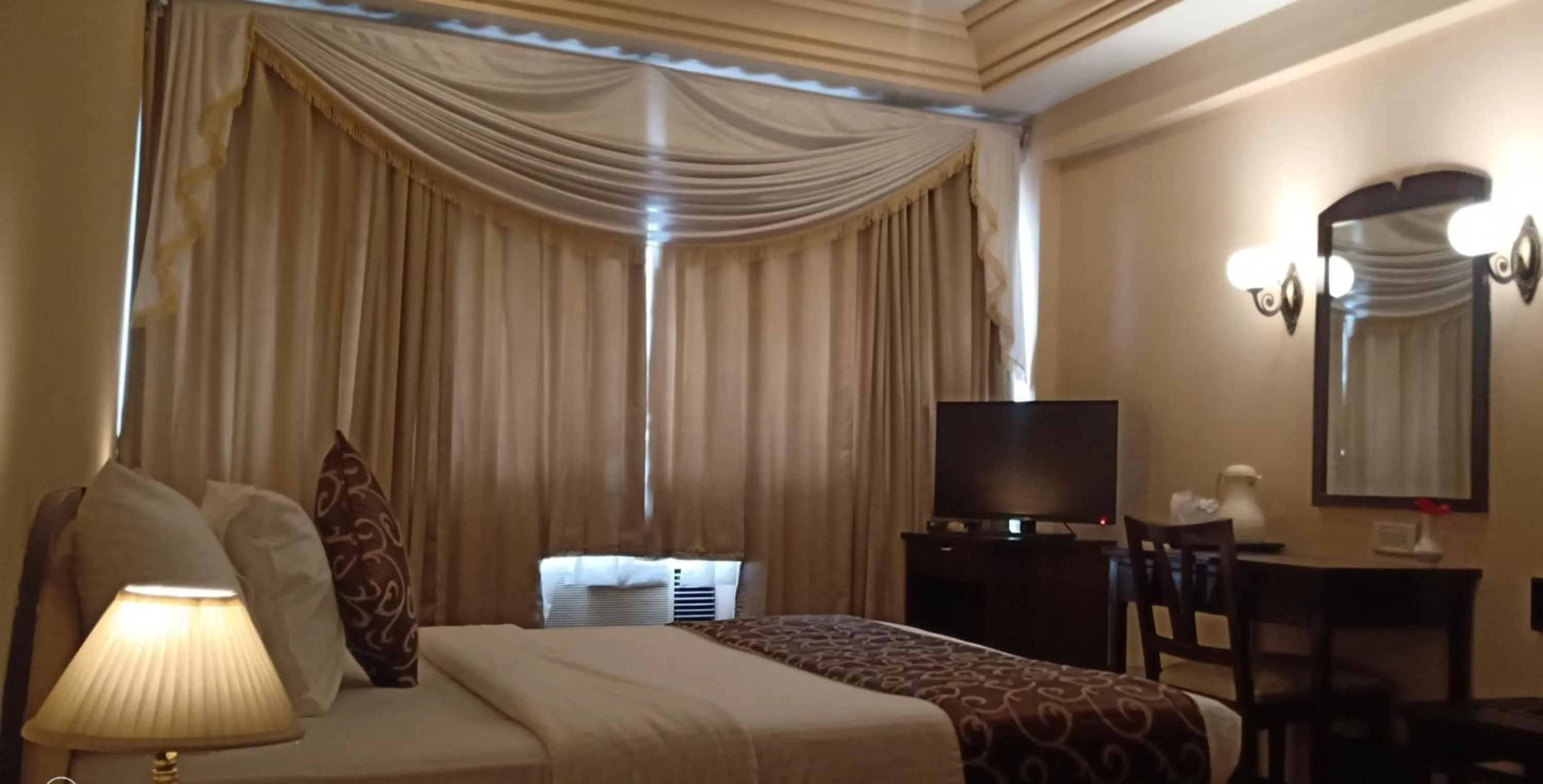 Bed in Hotel Poonja International