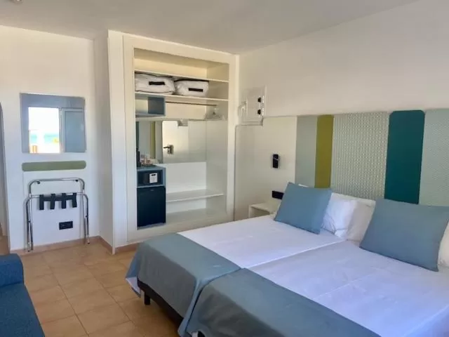 Bed in HOTEL BOUTIQUE CABO SUR