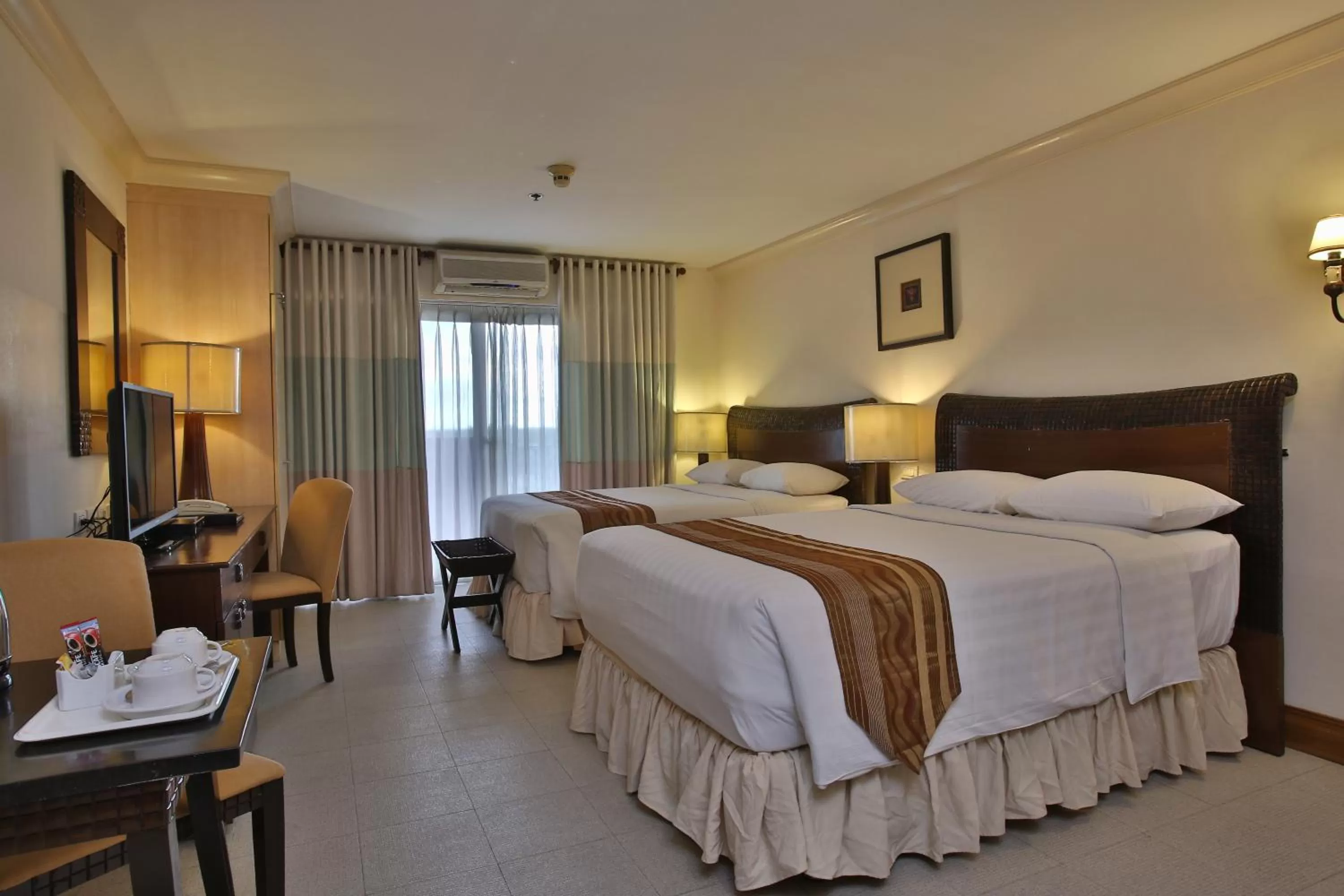 Bed in Crown Regency Suites Mactan