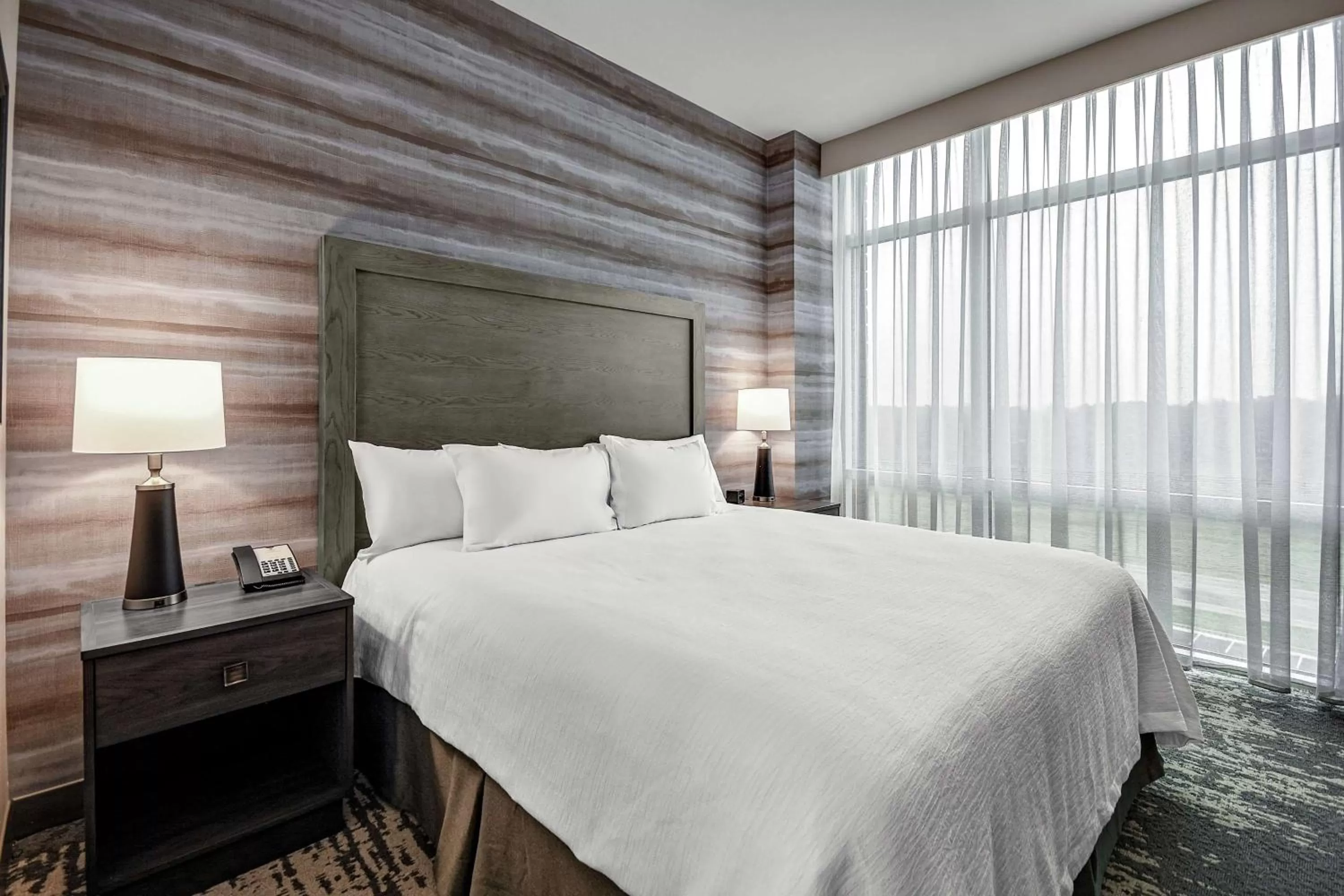 Bed in Embassy Suites by Hilton Jonesboro Red Wolf Convention Center