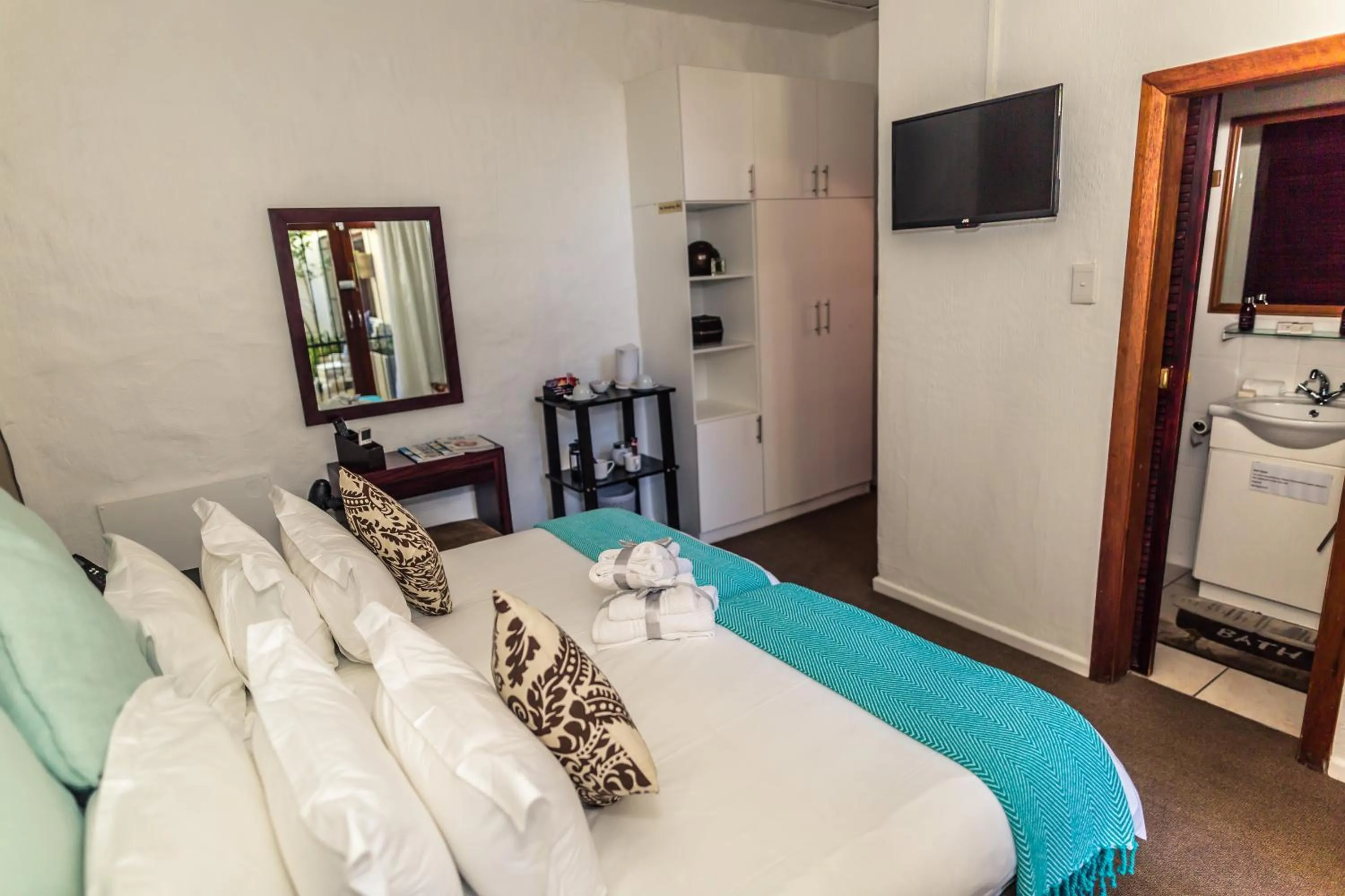 Bed in Point B Guest House -Sustainable Solar Energy