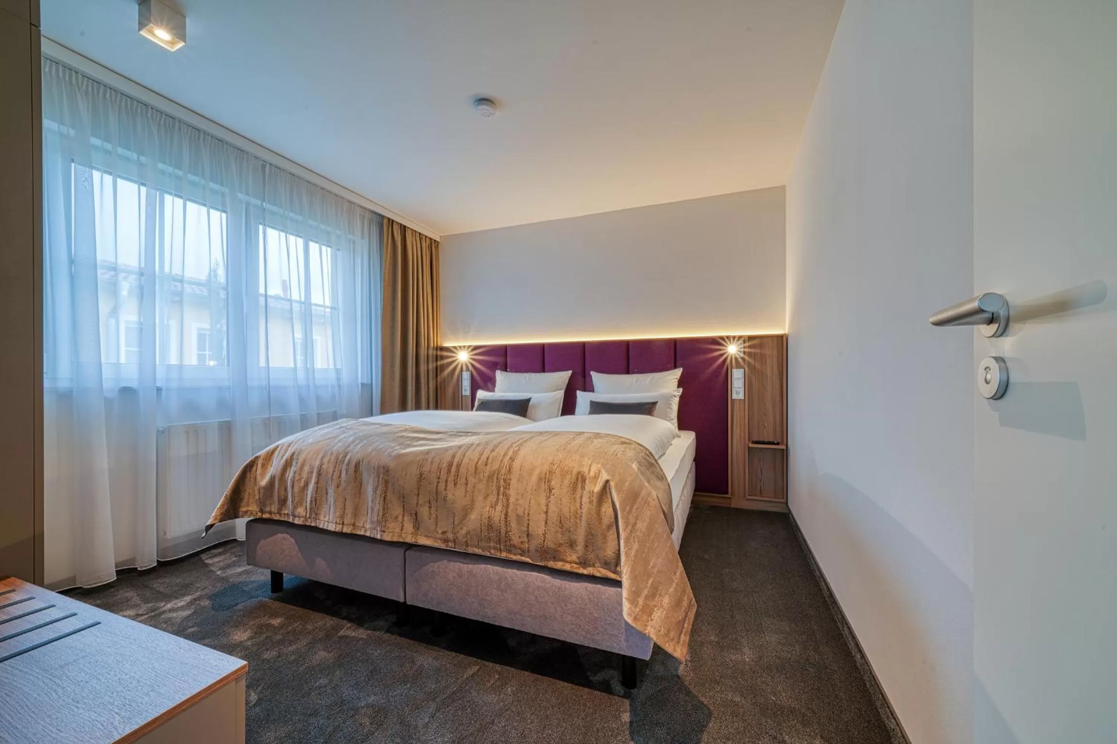 Bed in FourSide Hotel Ringsheim, Trademark Collection by Wyndham