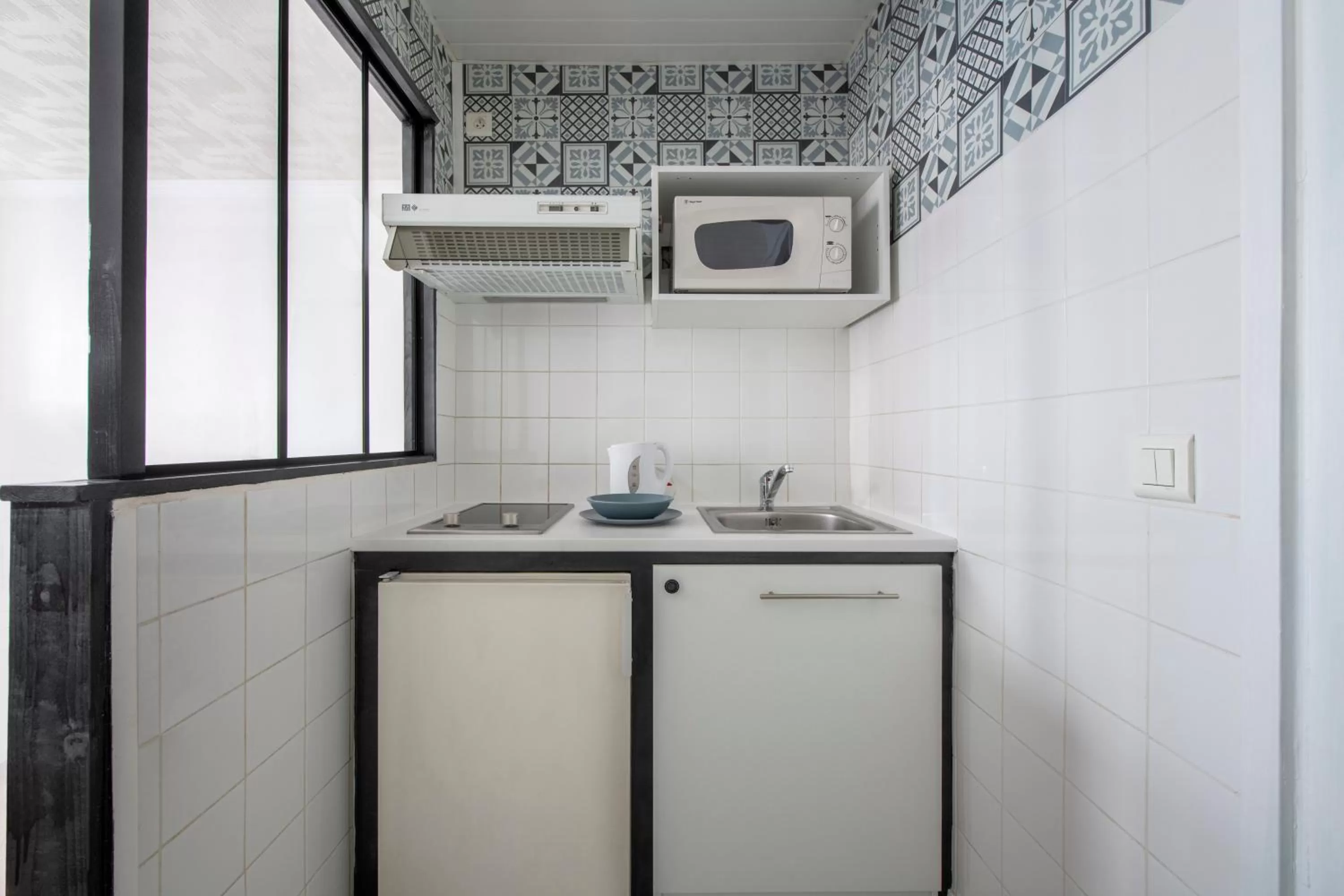 Kitchen or kitchenette in Royal Hotel Versailles