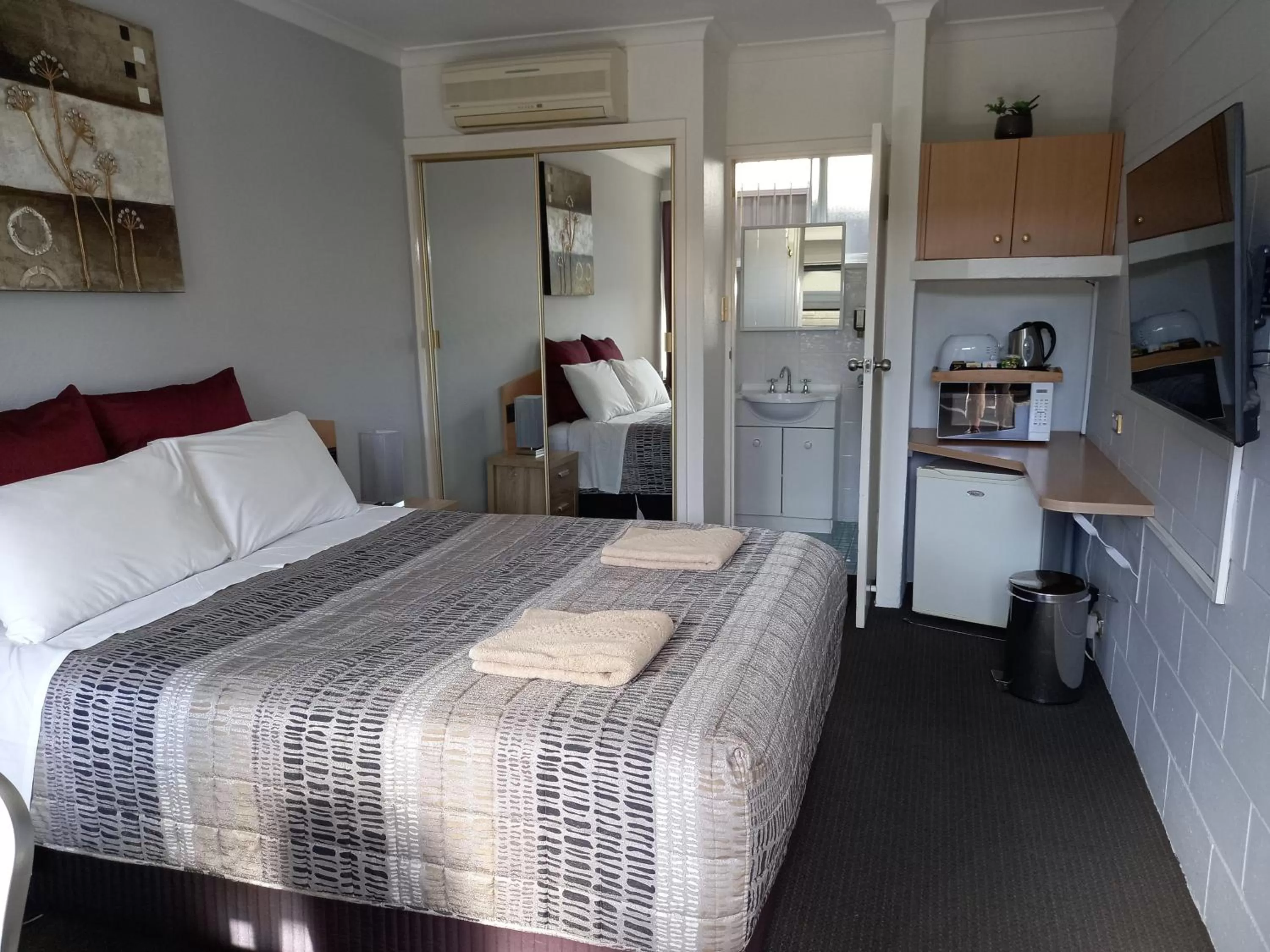 Bed in White Manor Motel