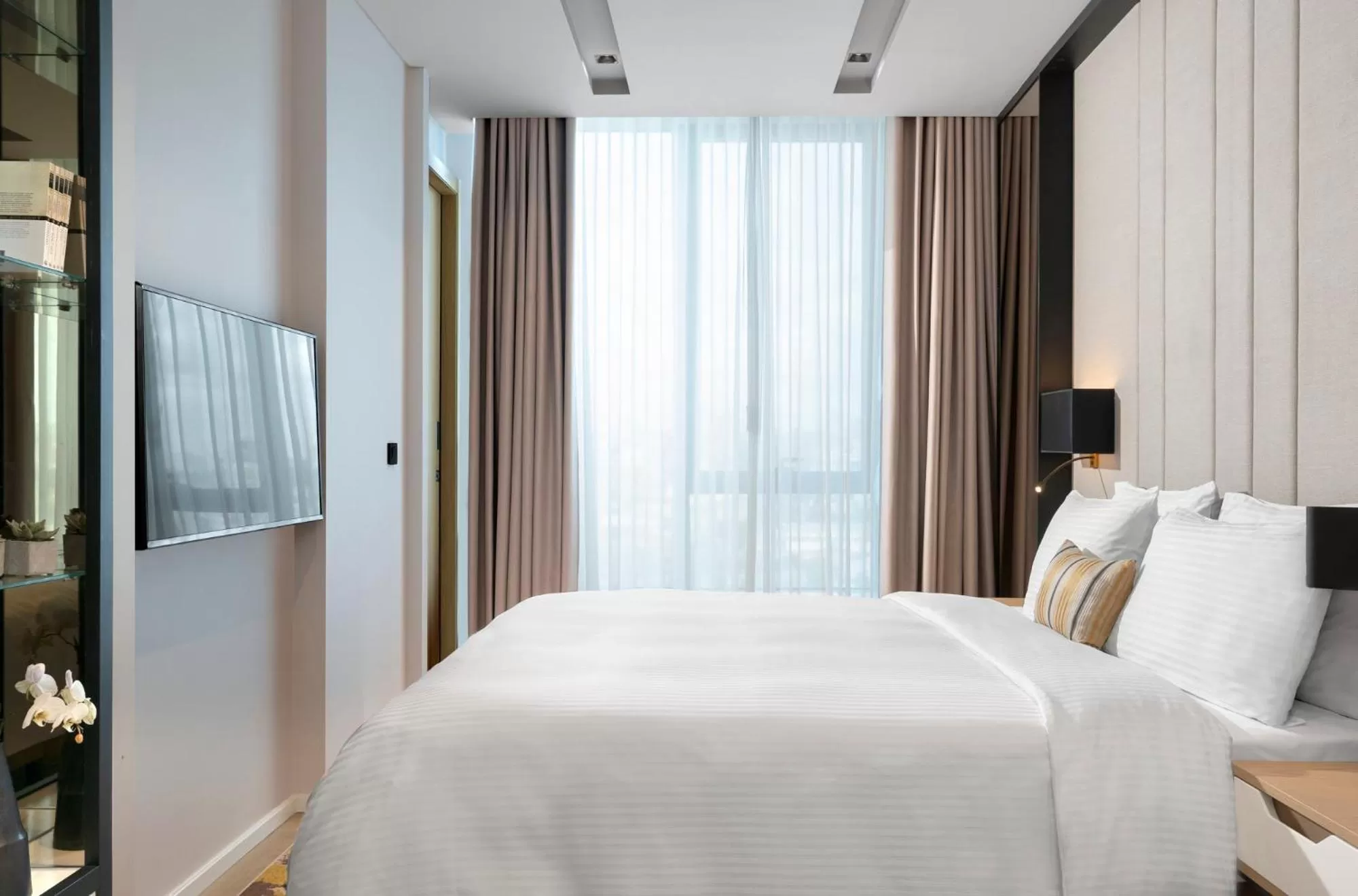 Bed in WestSide Residences by Rotana