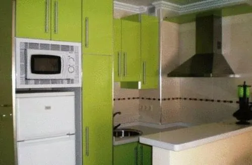 Kitchen or kitchenette in Apartamentos Turísticos Plaza del Olvido