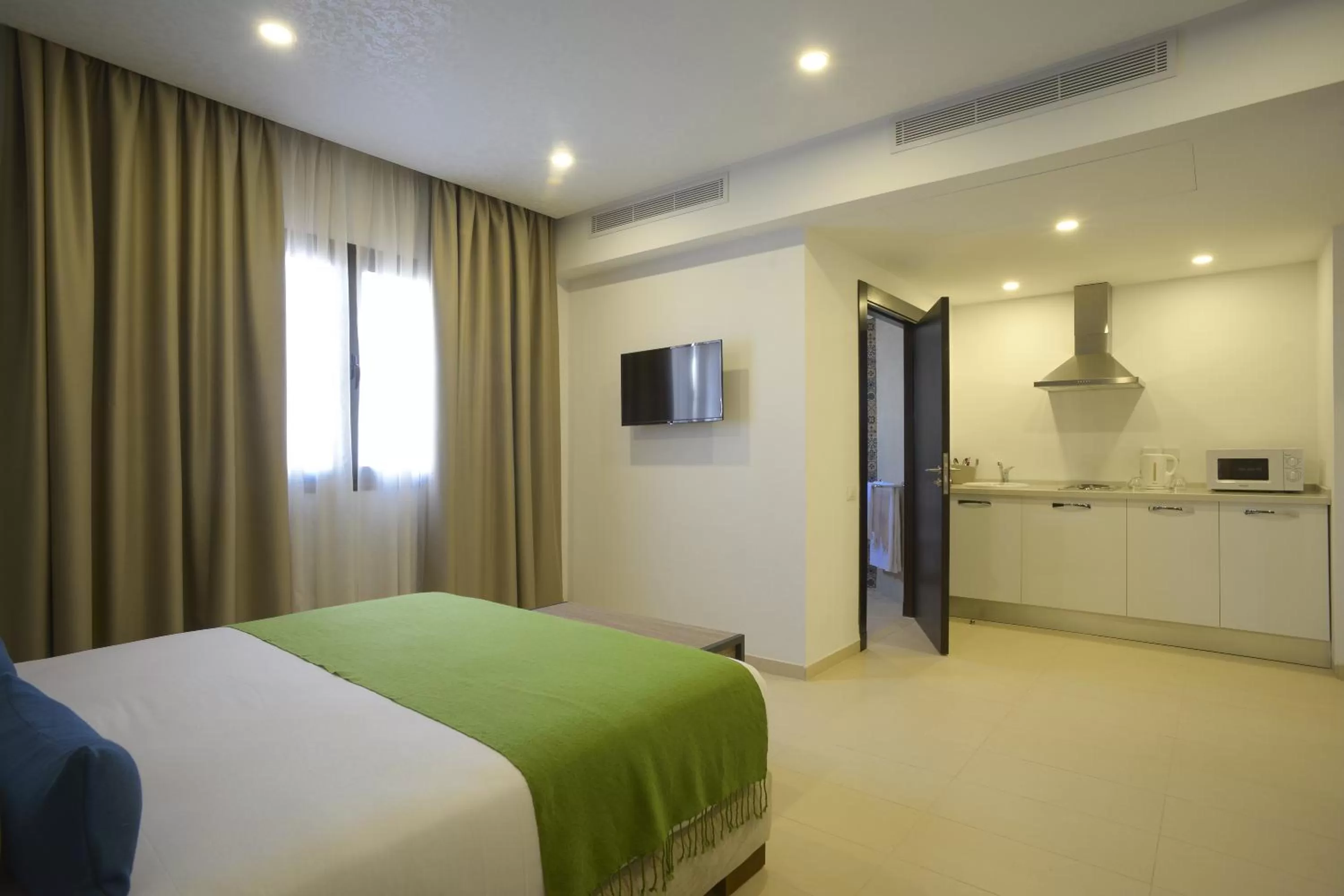 Photo of the whole room, Bed in MAIA HOTEL SUITES