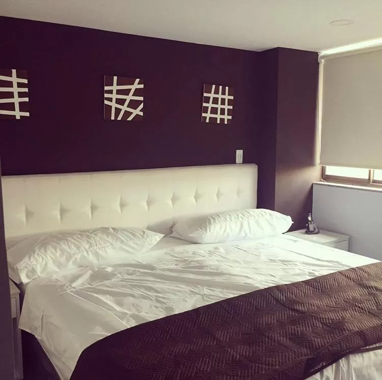 Bed in Hotel Garden City Boutique