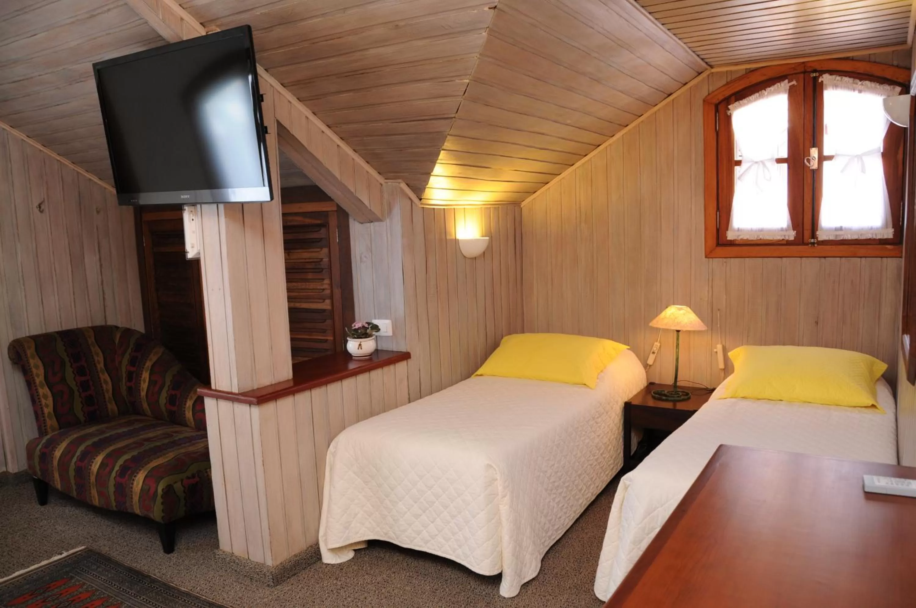 Bed in Pousada Villa Capivary Campos do Jordão