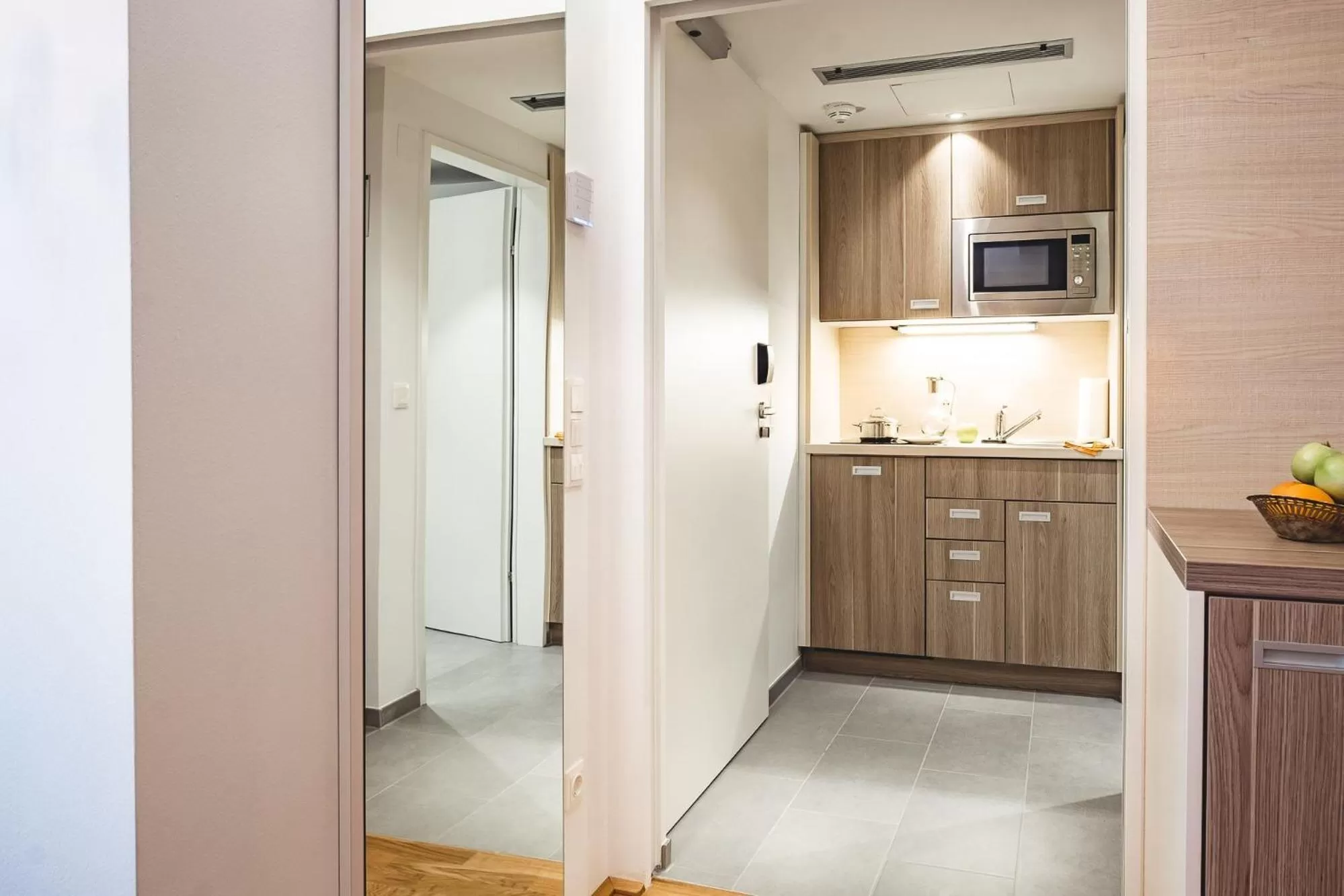Kitchen or kitchenette in Oliver Apartments | contactless check-in