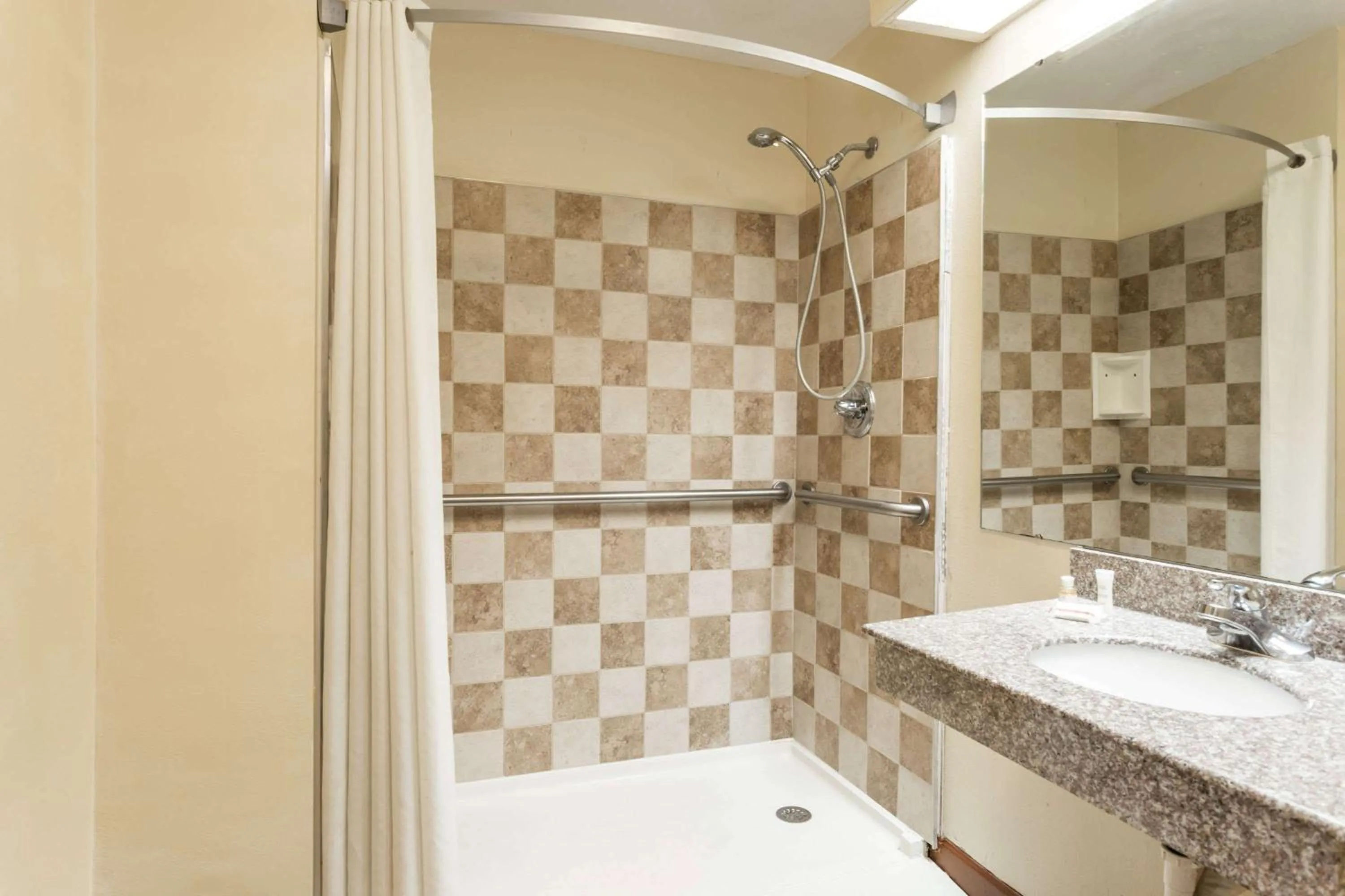 Bathroom in Super 8 by Wyndham Norcross/I-85 Atlanta