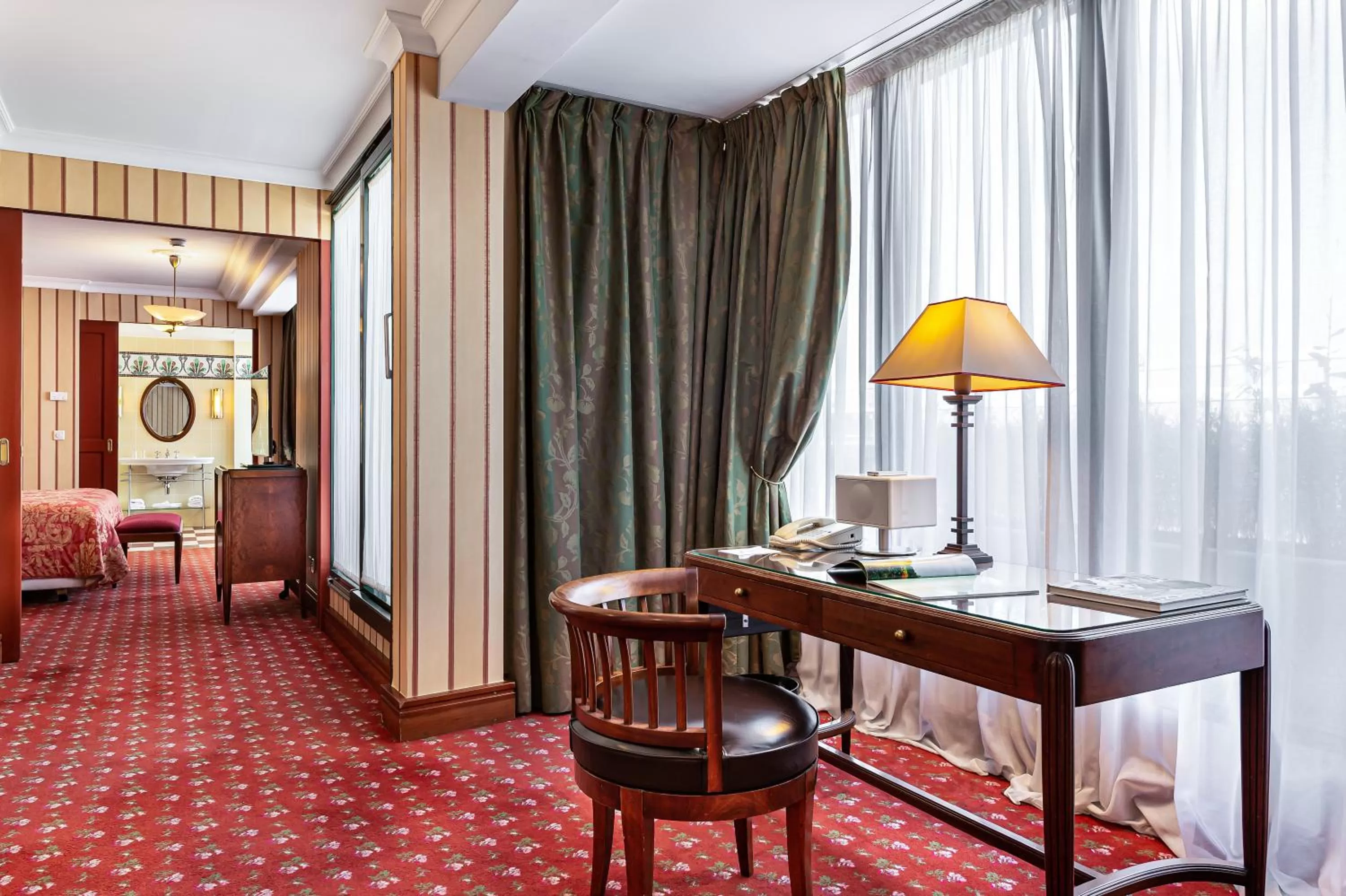 Seating area, Bed in Royal Manotel