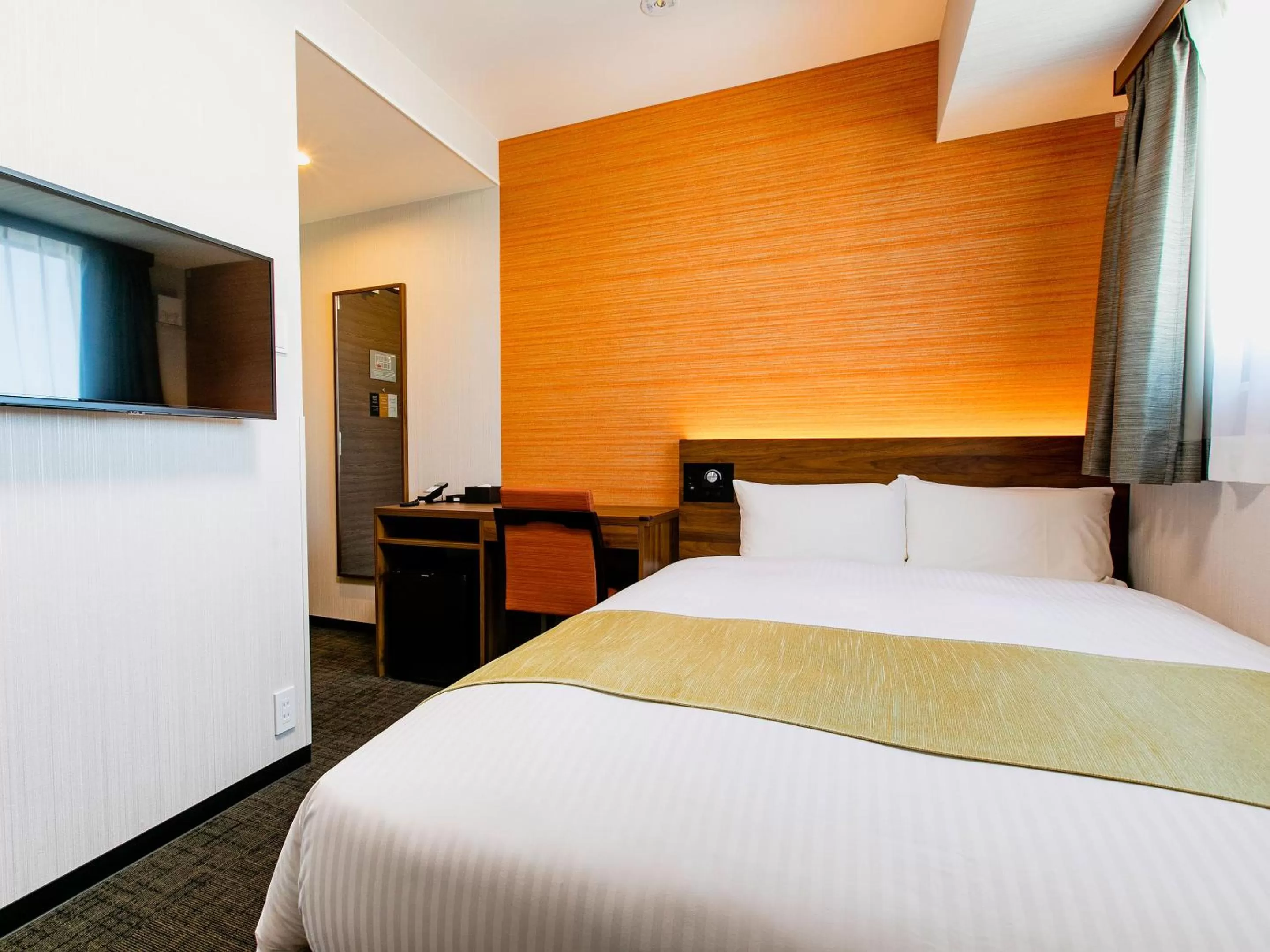 Bed in KOKO HOTEL Takamatsu - formerly Hotel Wing Takamatsu