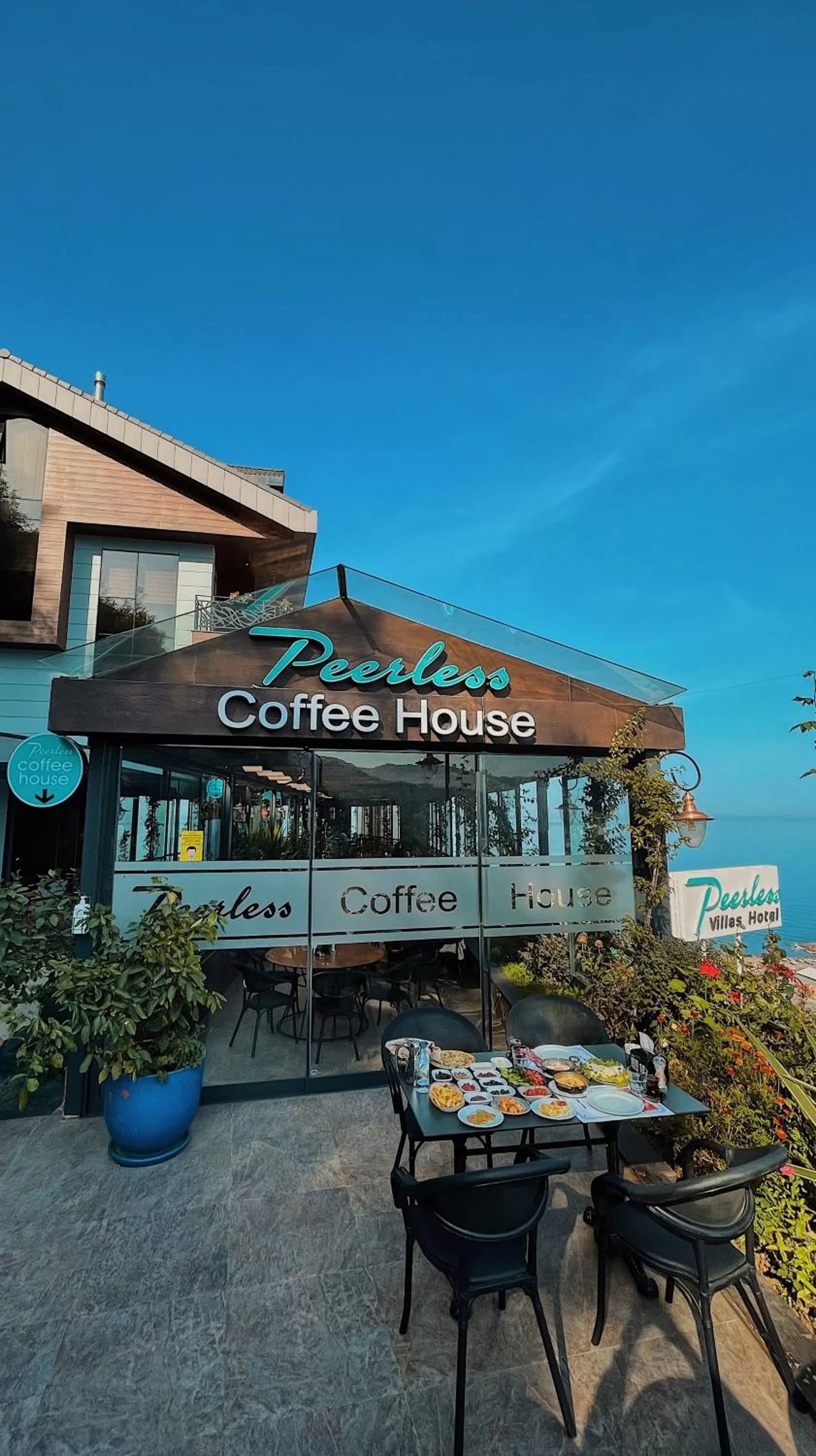 Property logo or sign in Peerless Villas Hotel