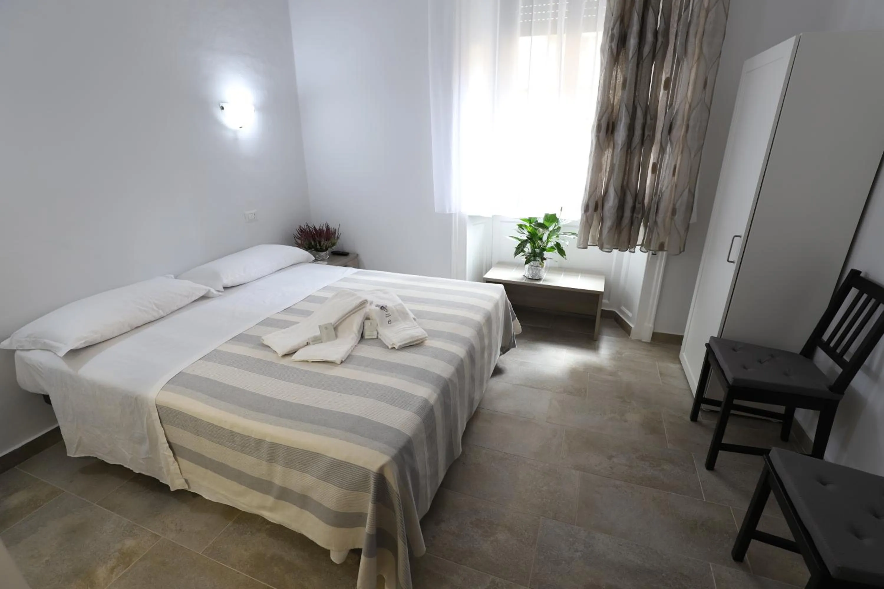 Bed in Albergo Leonardo Da Vinci