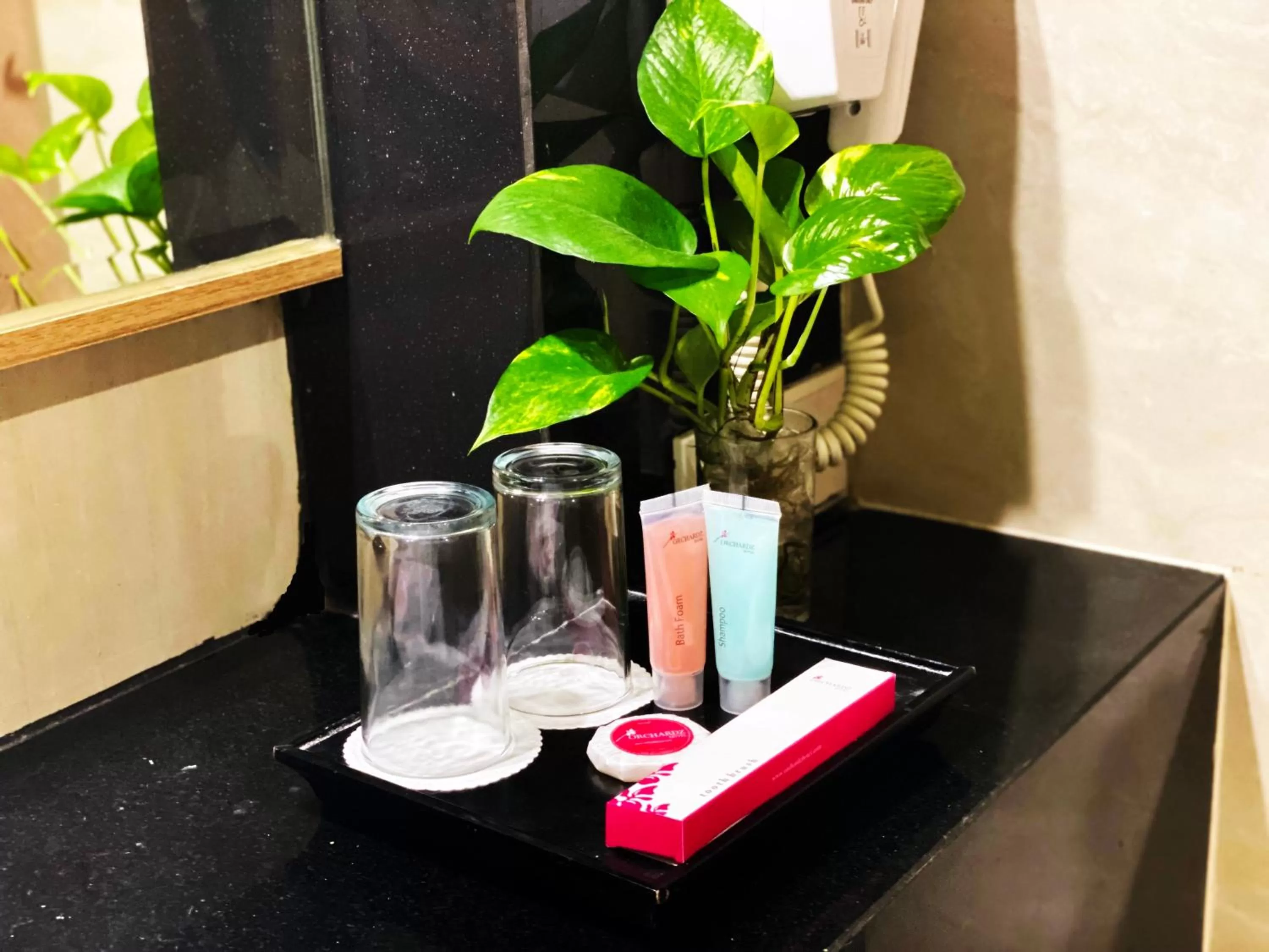 Toilet in Orchardz Hotel Industri Jakarta Kemayoran