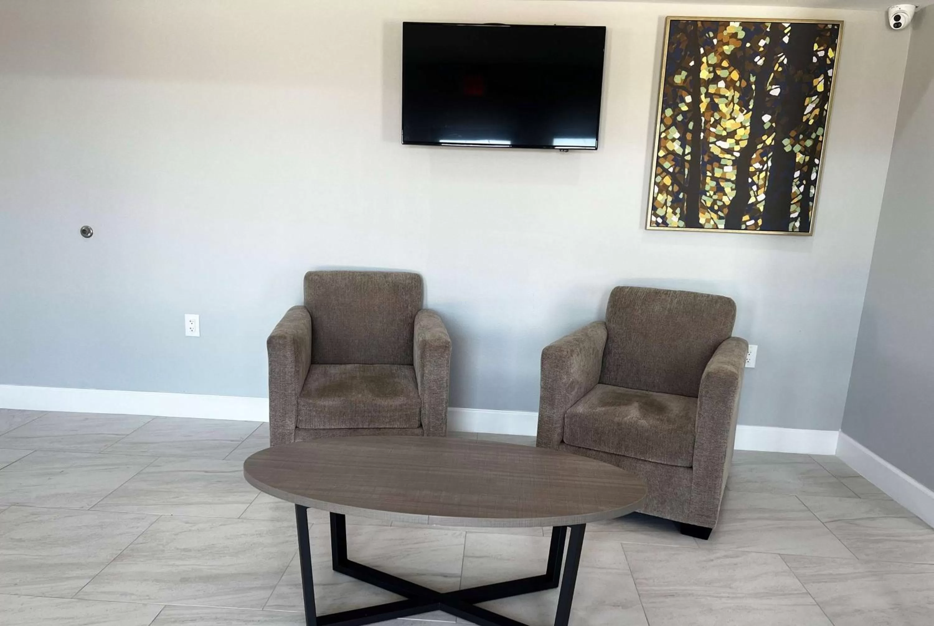Communal lounge/ TV room in Baymont by Wyndham Freeport Texas