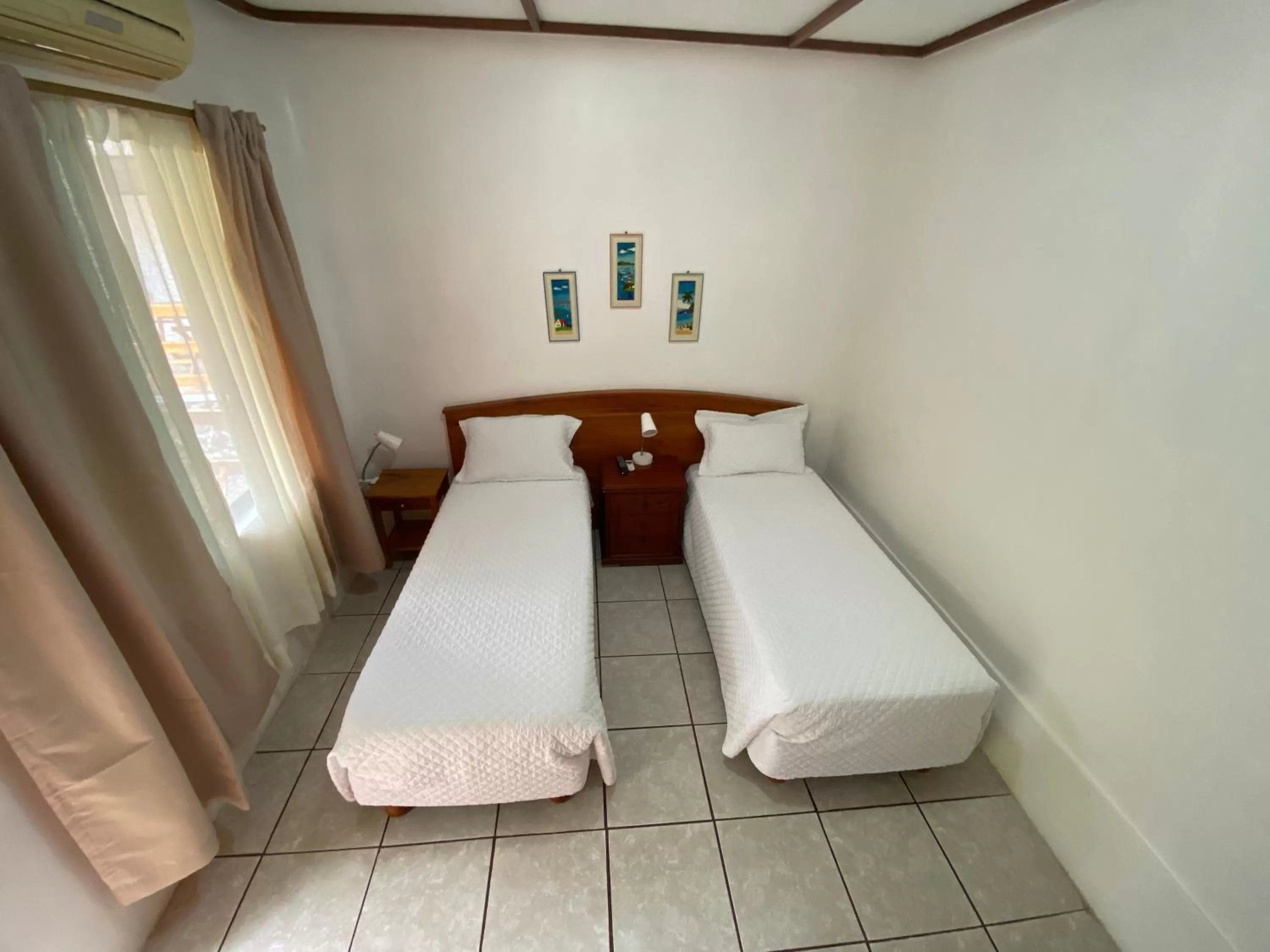 Bed in La Peregrina Galapagos B&B