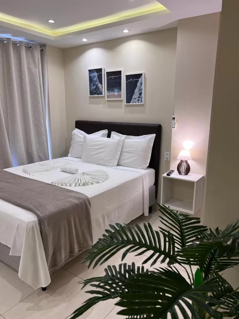 Bed in Pousada Arraial Tropical