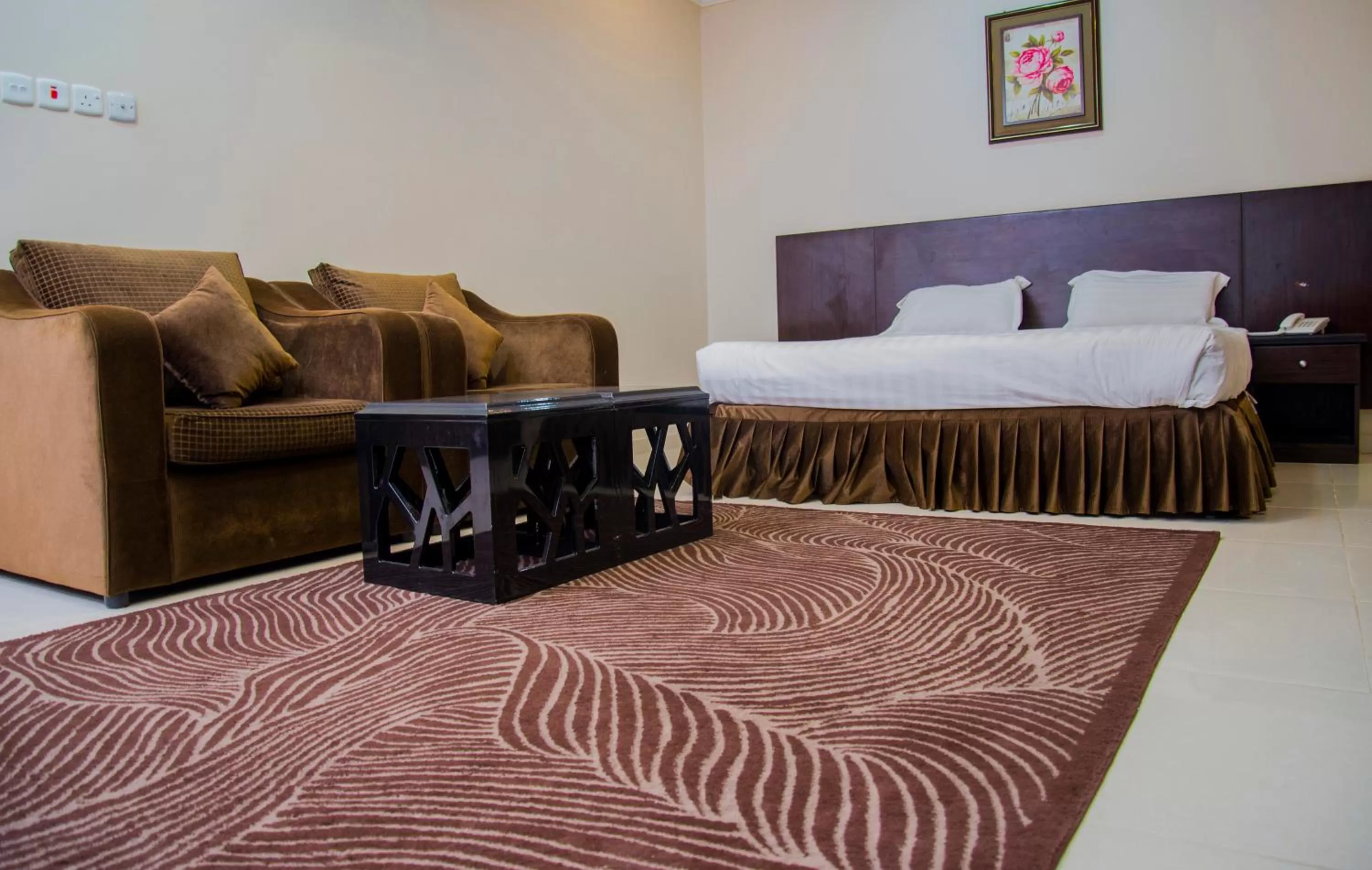 Bedroom, Seating Area in Shams Suites Furnished Units