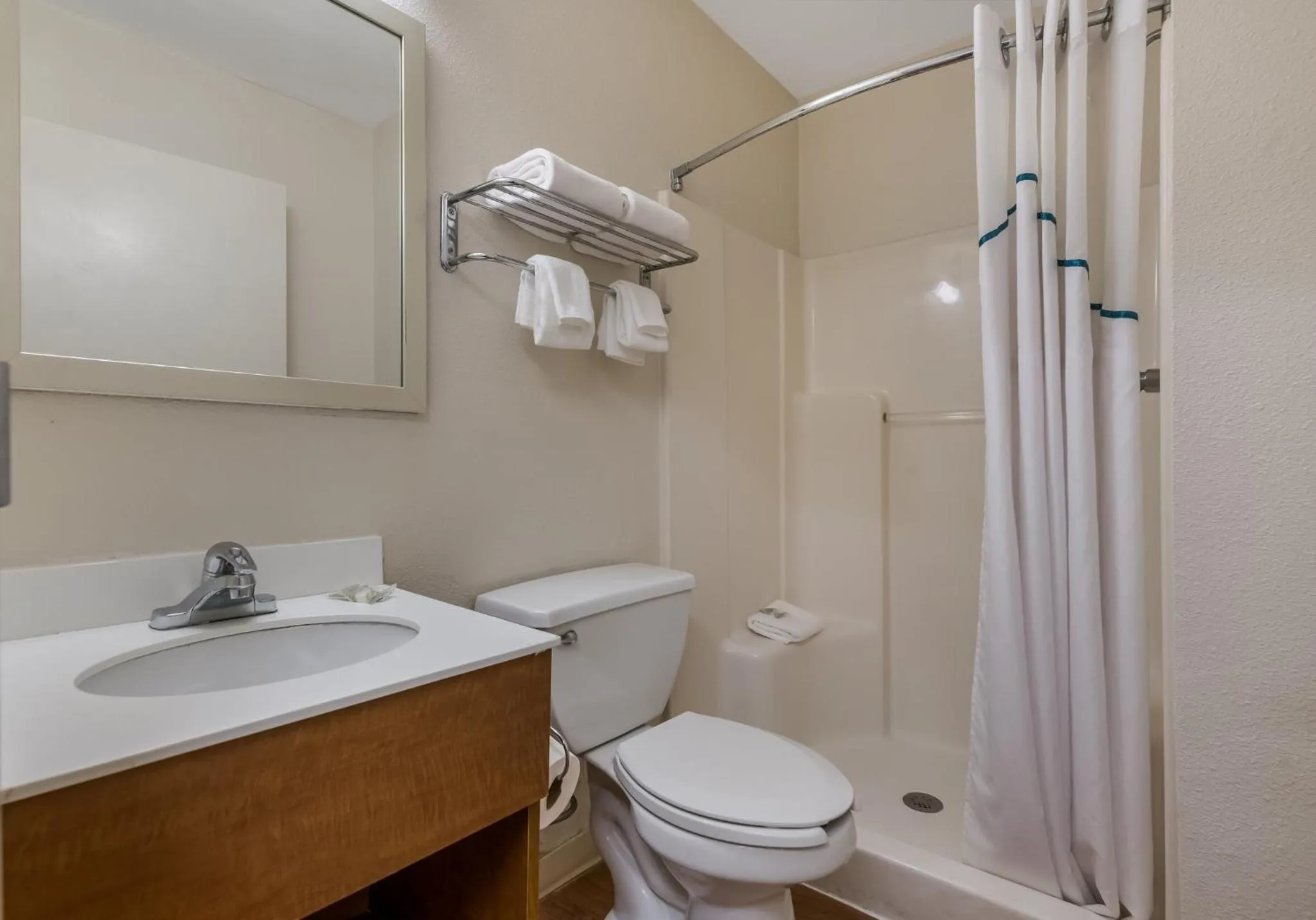 Bathroom in HomeTowne Studios by Red Roof Orlando - UCF Area