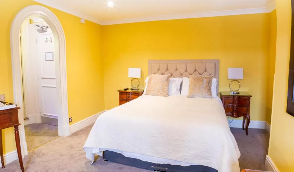 Bed in Angel and Royal Hotel