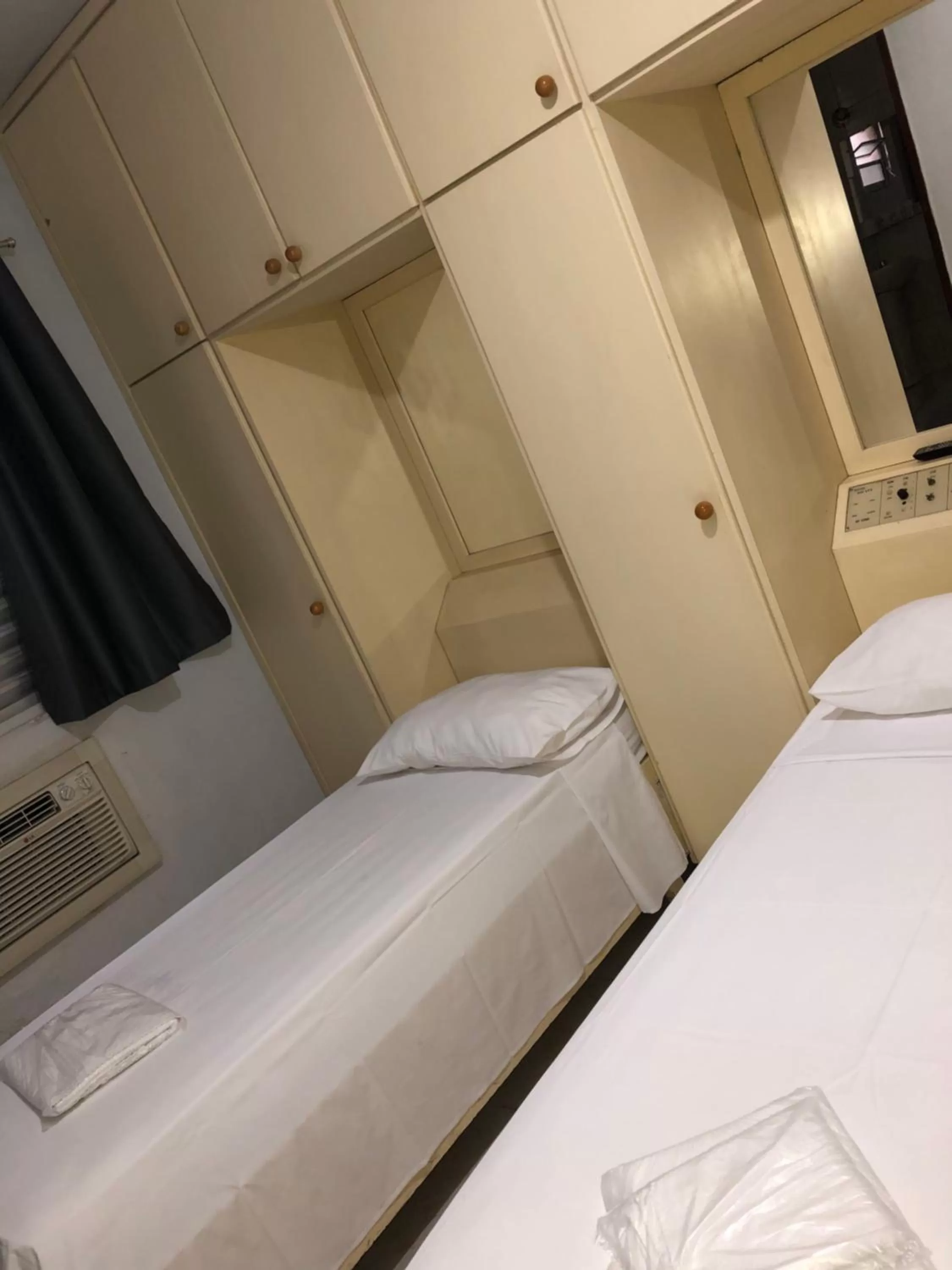 Bed in Center Plaza Hotel