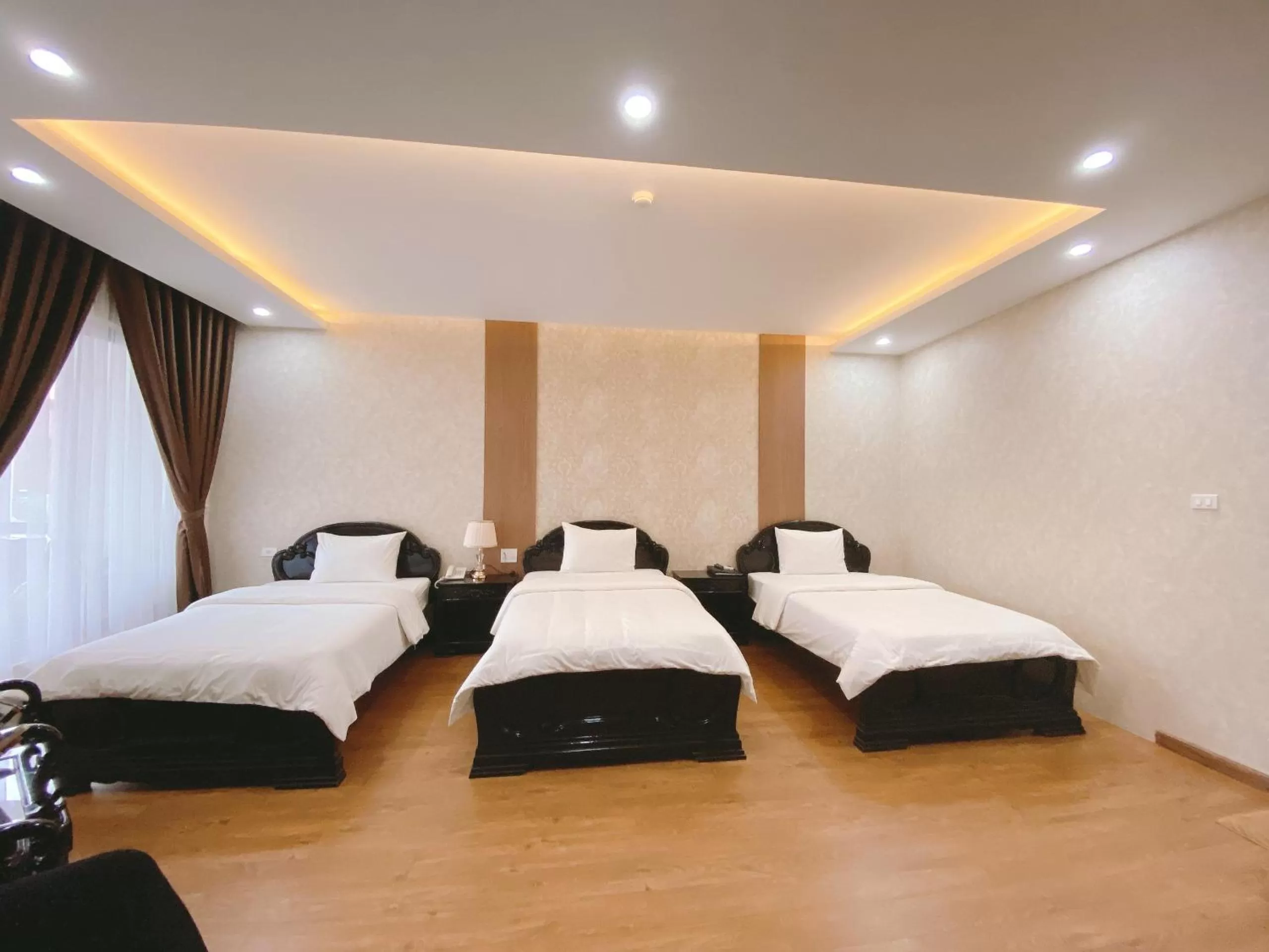 Bed in Galaxy Grand Hotel