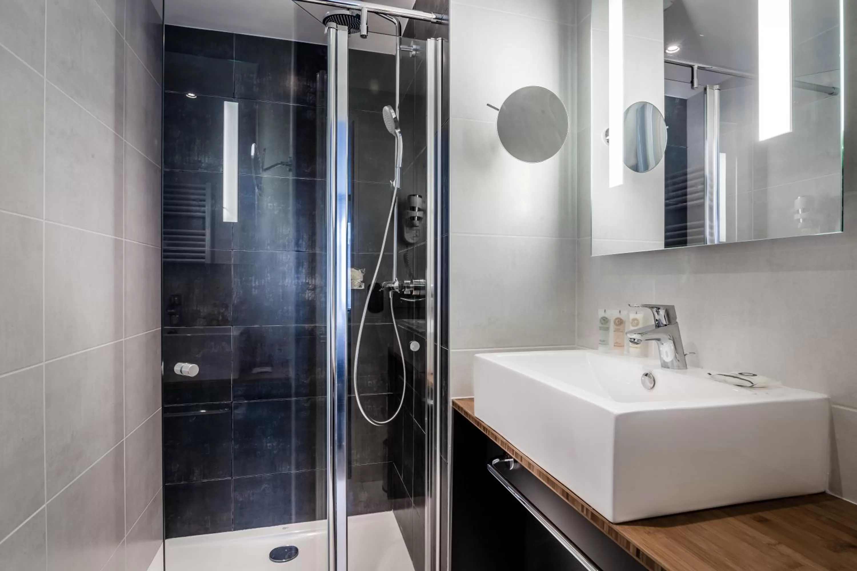 Shower in Best Western Plus Suitcase Paris La Défense