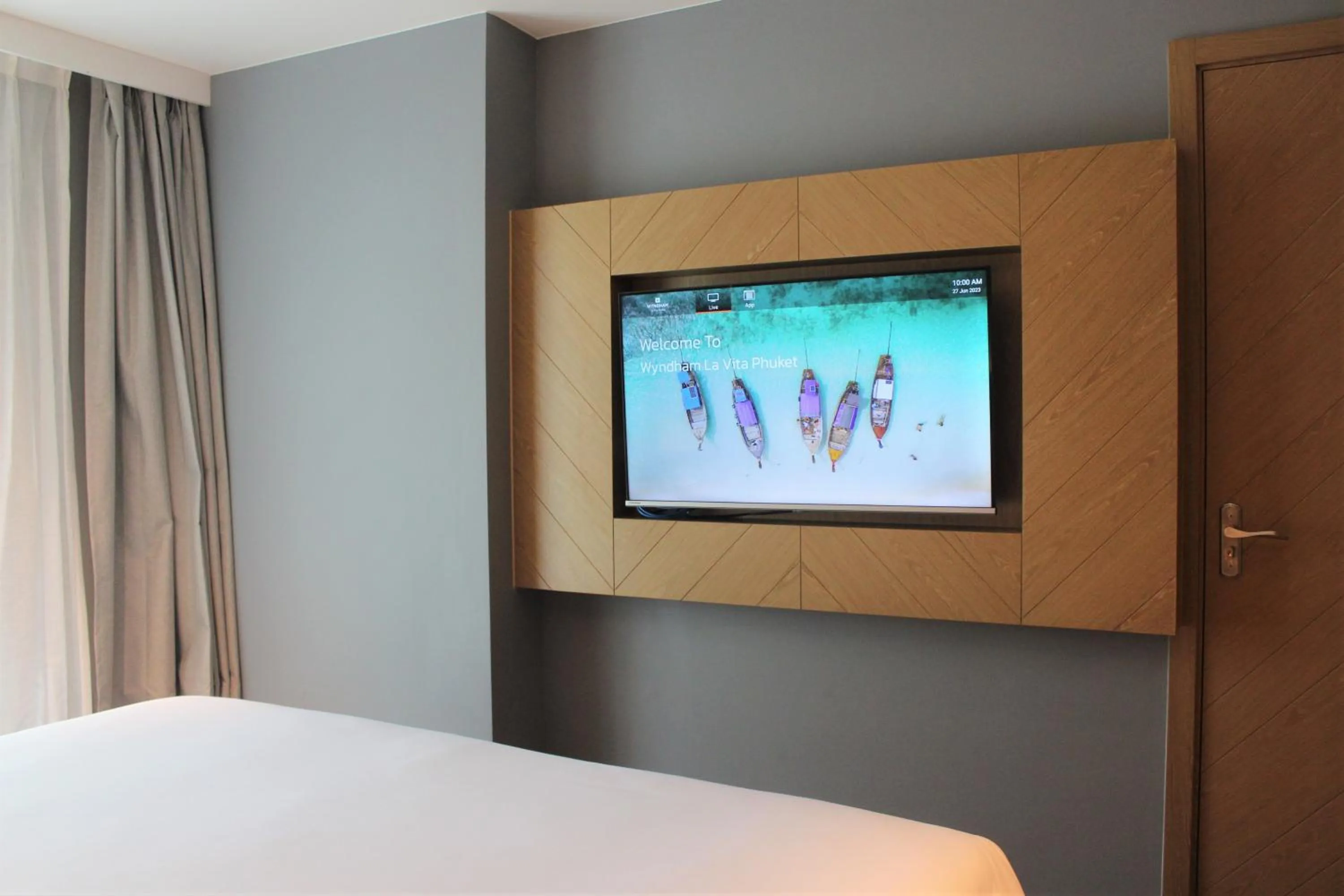 Communal lounge/ TV room, Bed in Wyndham La Vita Rawai Phuket