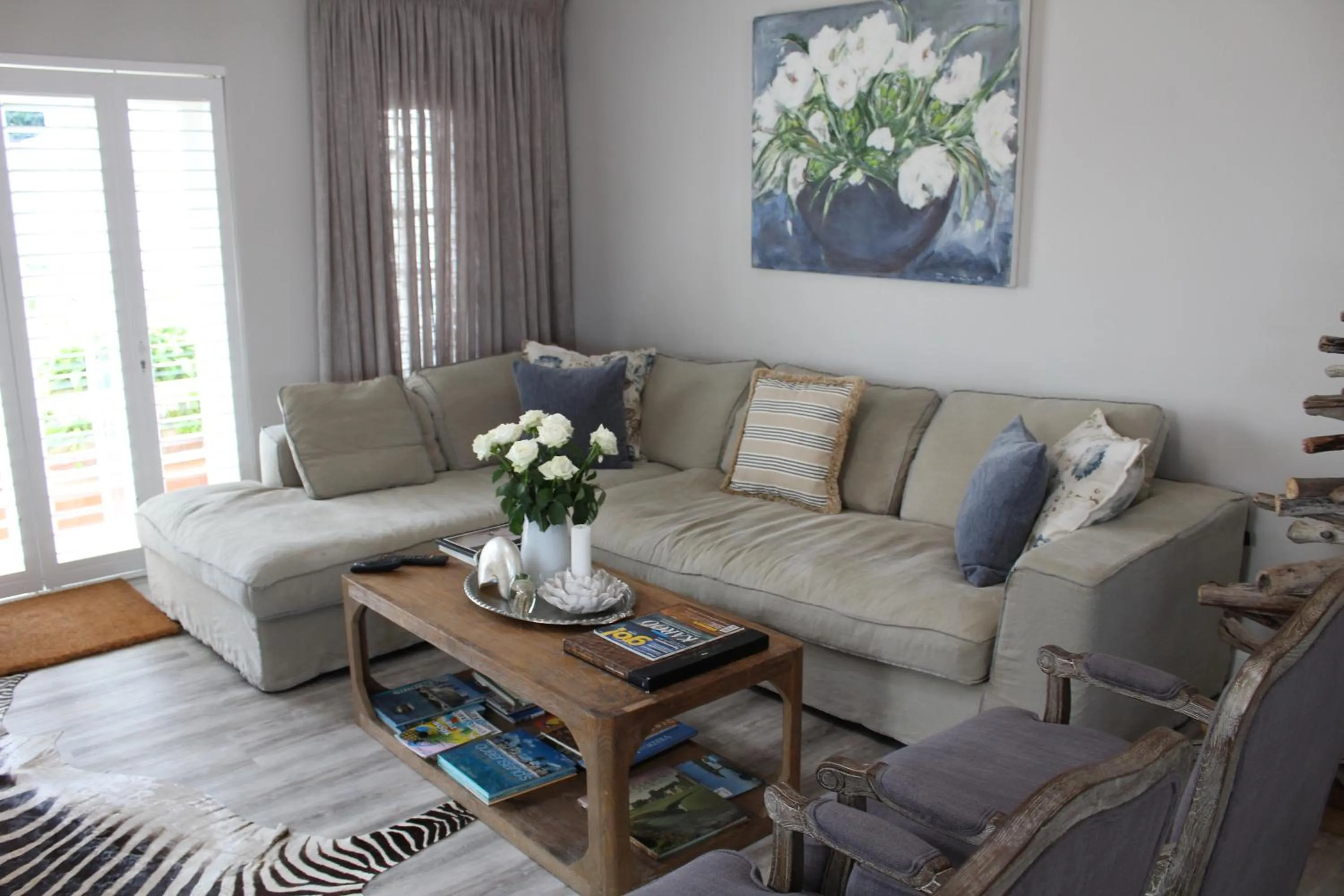 Communal lounge/ TV room in Sandals Guest House