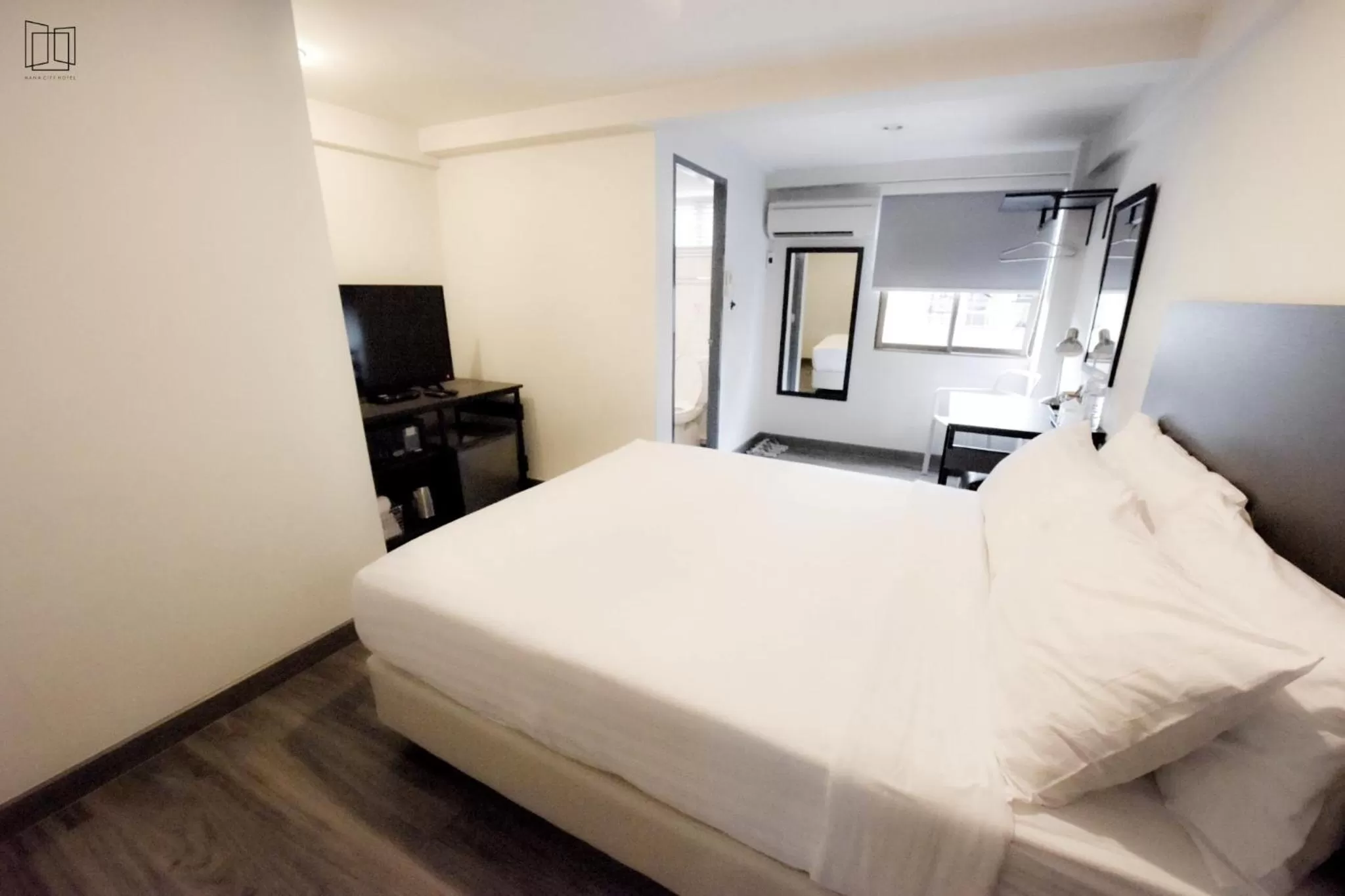 Bed in Nana City Hotel