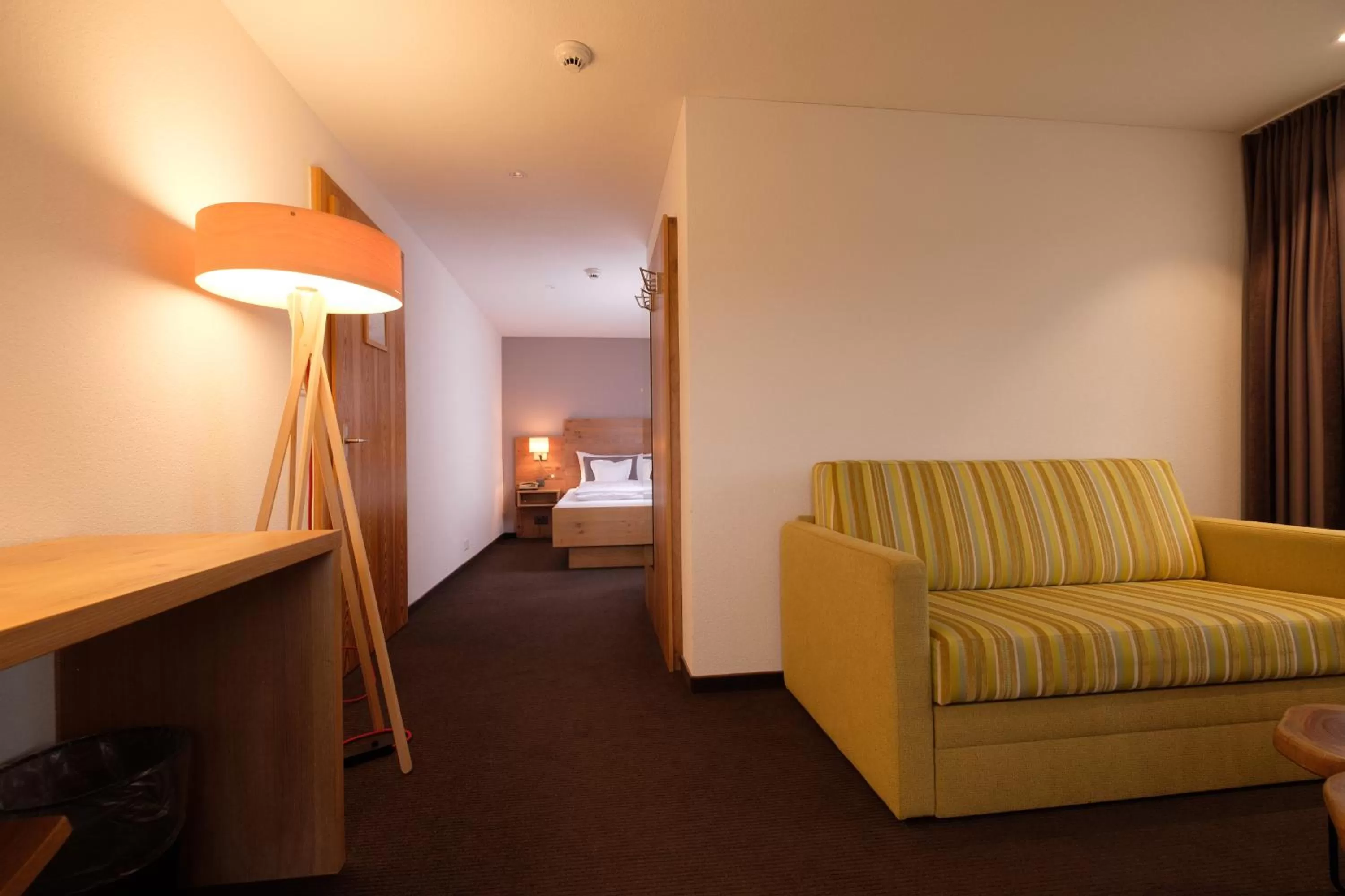 Bed, Seating Area in Hotel Friedheim