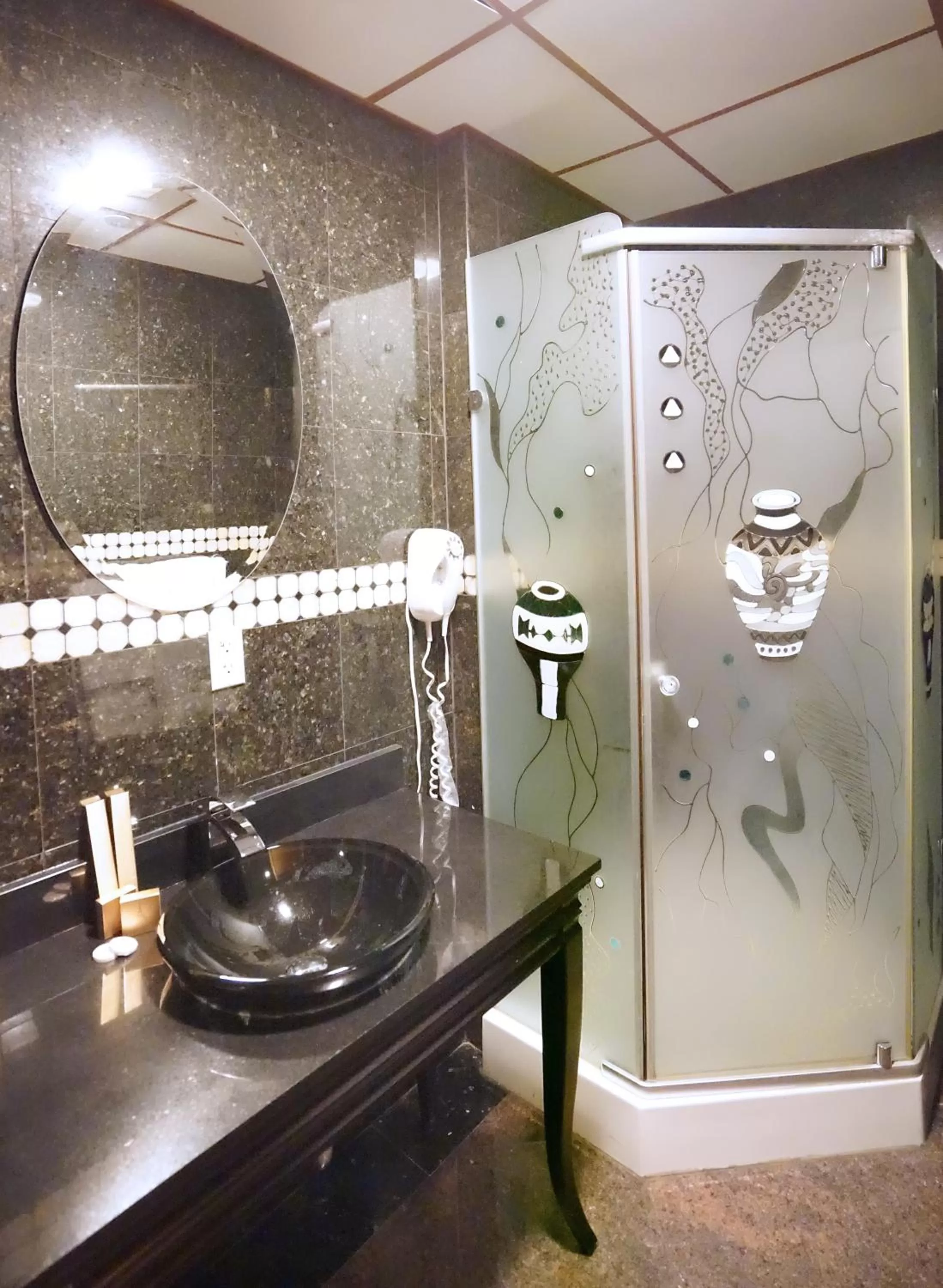 Bathroom in Paris Suites Hotel