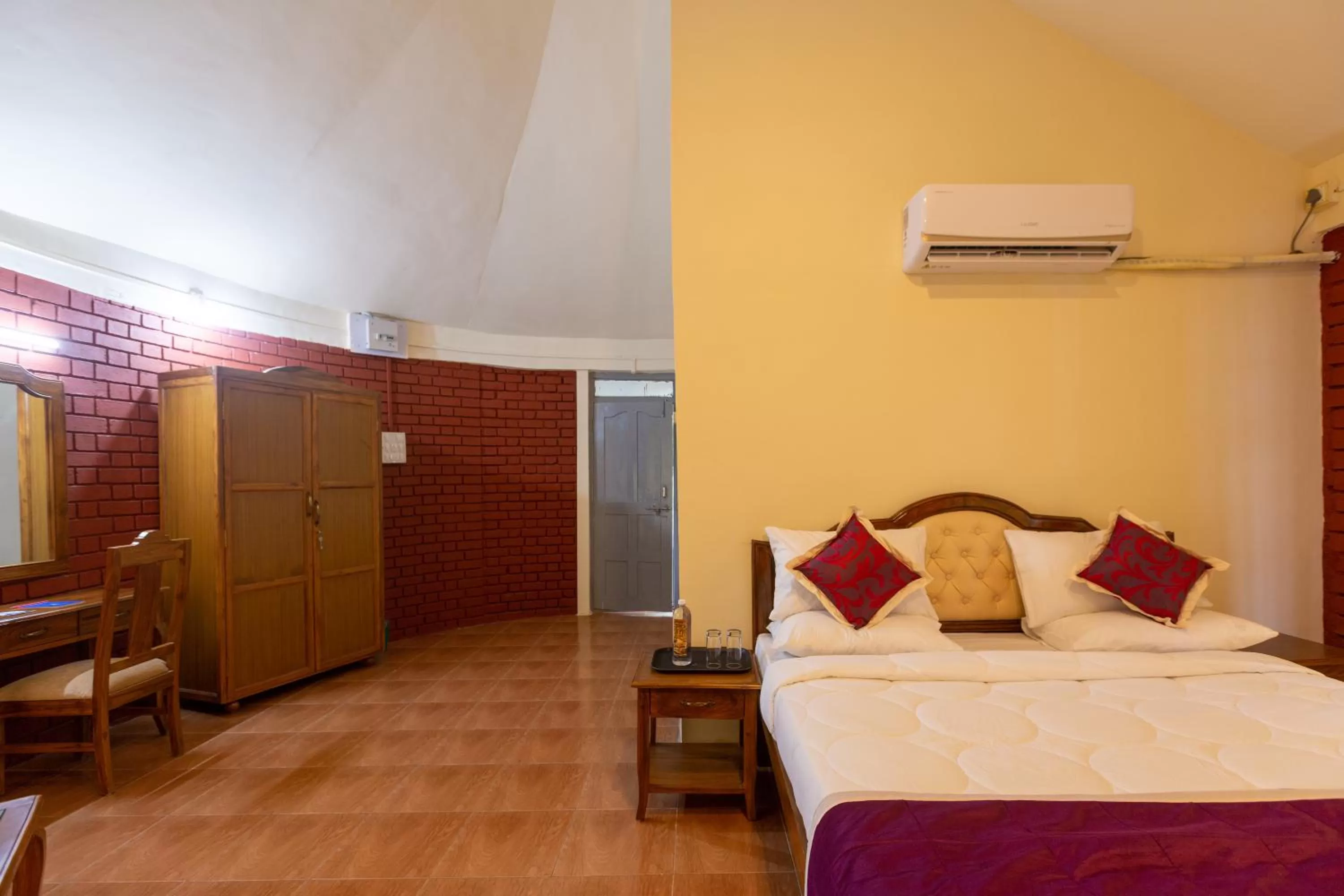 Bed in KSTDC Hotel Mayura Krishna Almatti