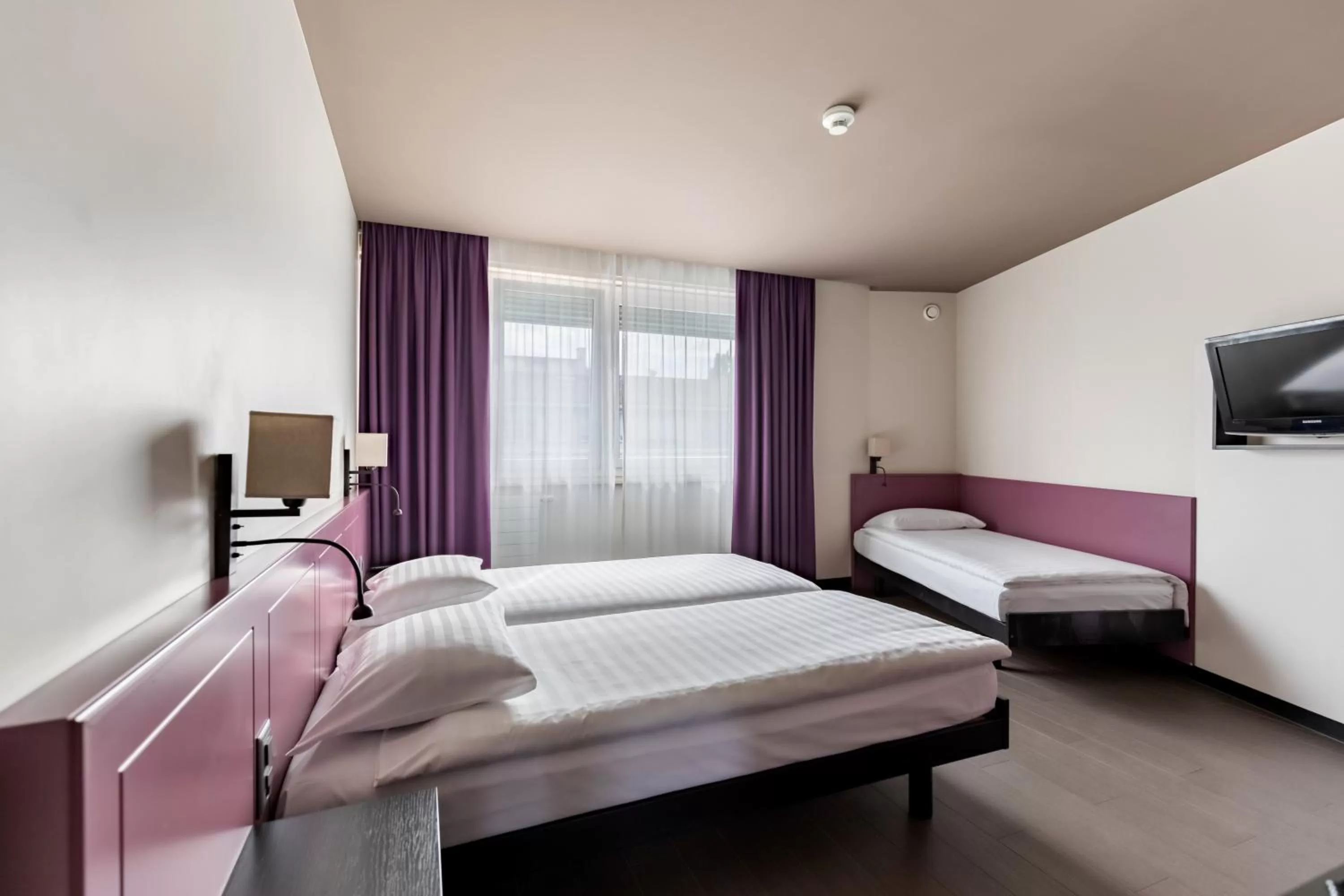 Bed in Hôtel Les Nations