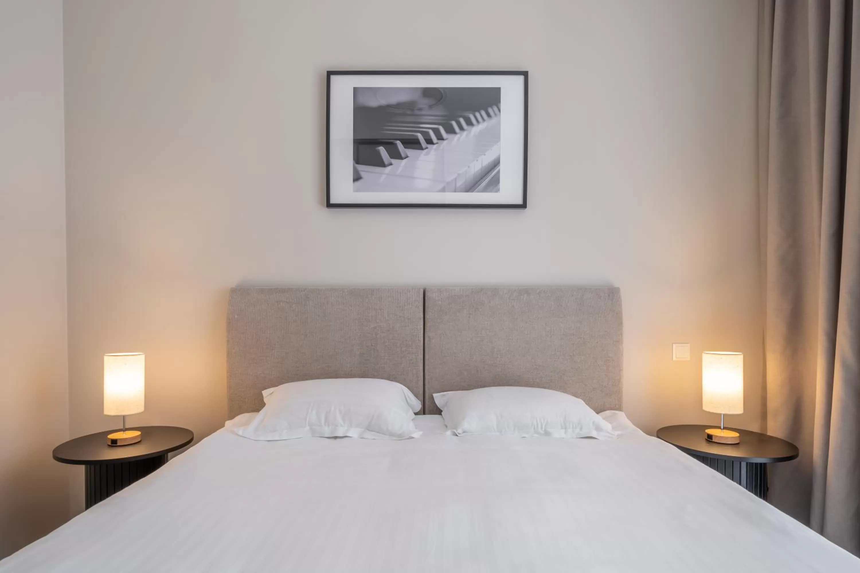 Bed in STORIES Design ApartHotel