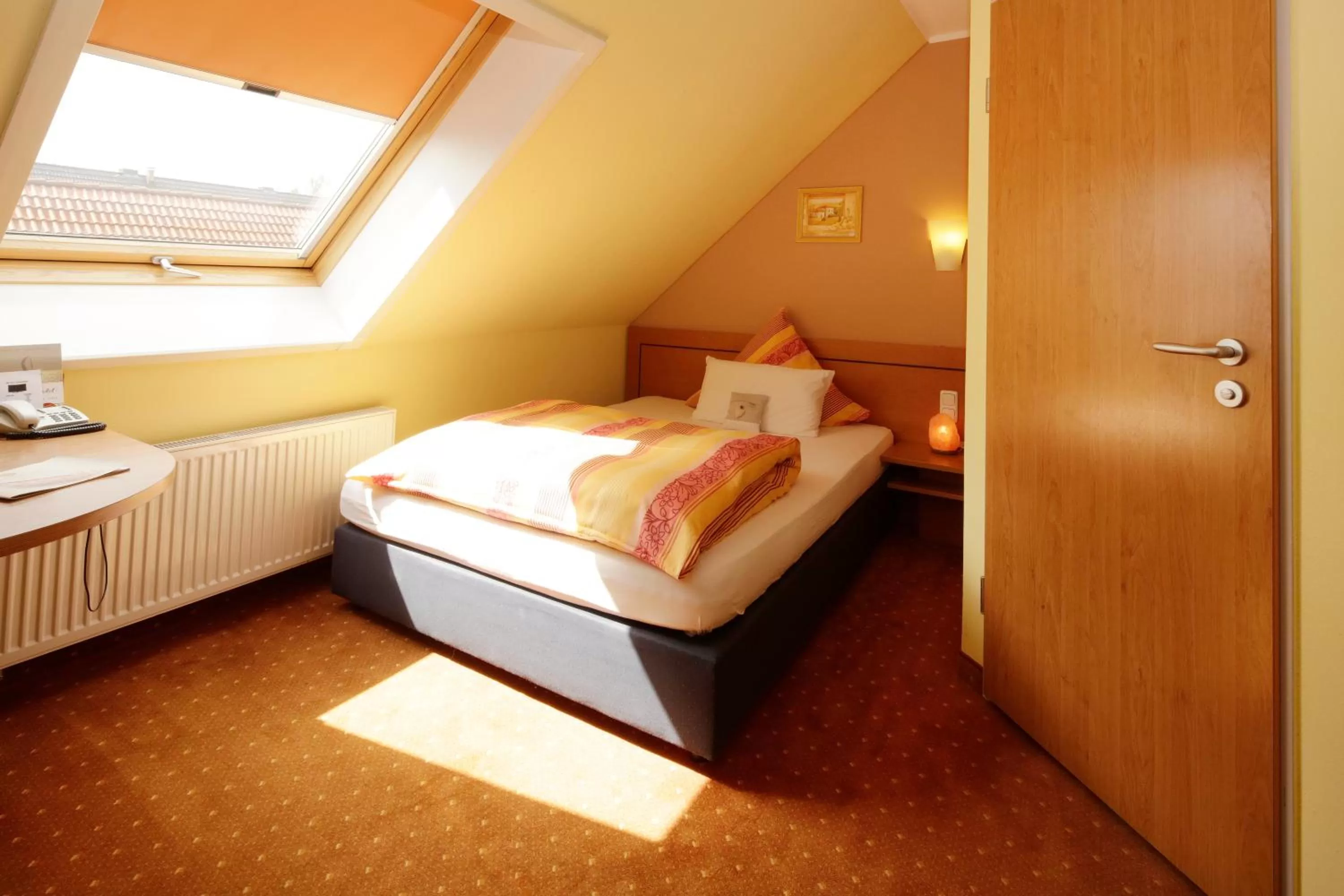 Photo of the whole room, Bed in BIO Hotel Bayerischer Wirt Augsburg